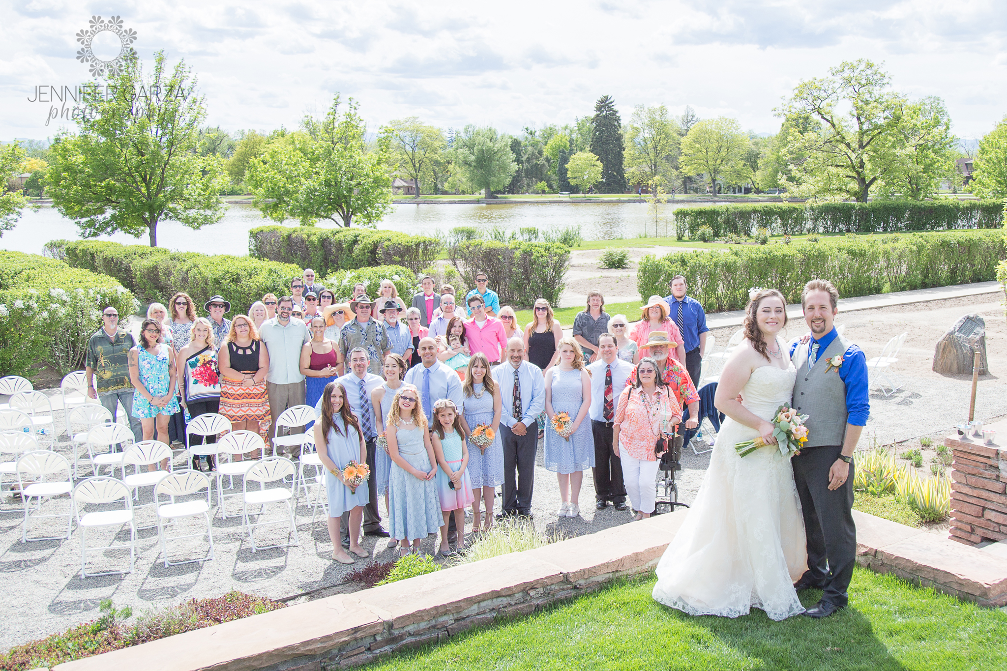 Large group photo of Bride & Groom's with their guests behind them during a summer wedding ceremony in the park. Rachael & Wes' Wash Park and Irish Rover Pub Denver Wedding by Colorado Wedding Photographer, Jennifer Garza. Colorado Wedding Photographer, Denver Wedding Photographer, Colorado Wedding Photos, Denver Wedding Photos, Colorado Bride, Denver Bride, Wash Park Wedding, Wash Park, Irish Rover Pub, Irish Rover Pub Wedding, Pub Wedding, Park Wedding