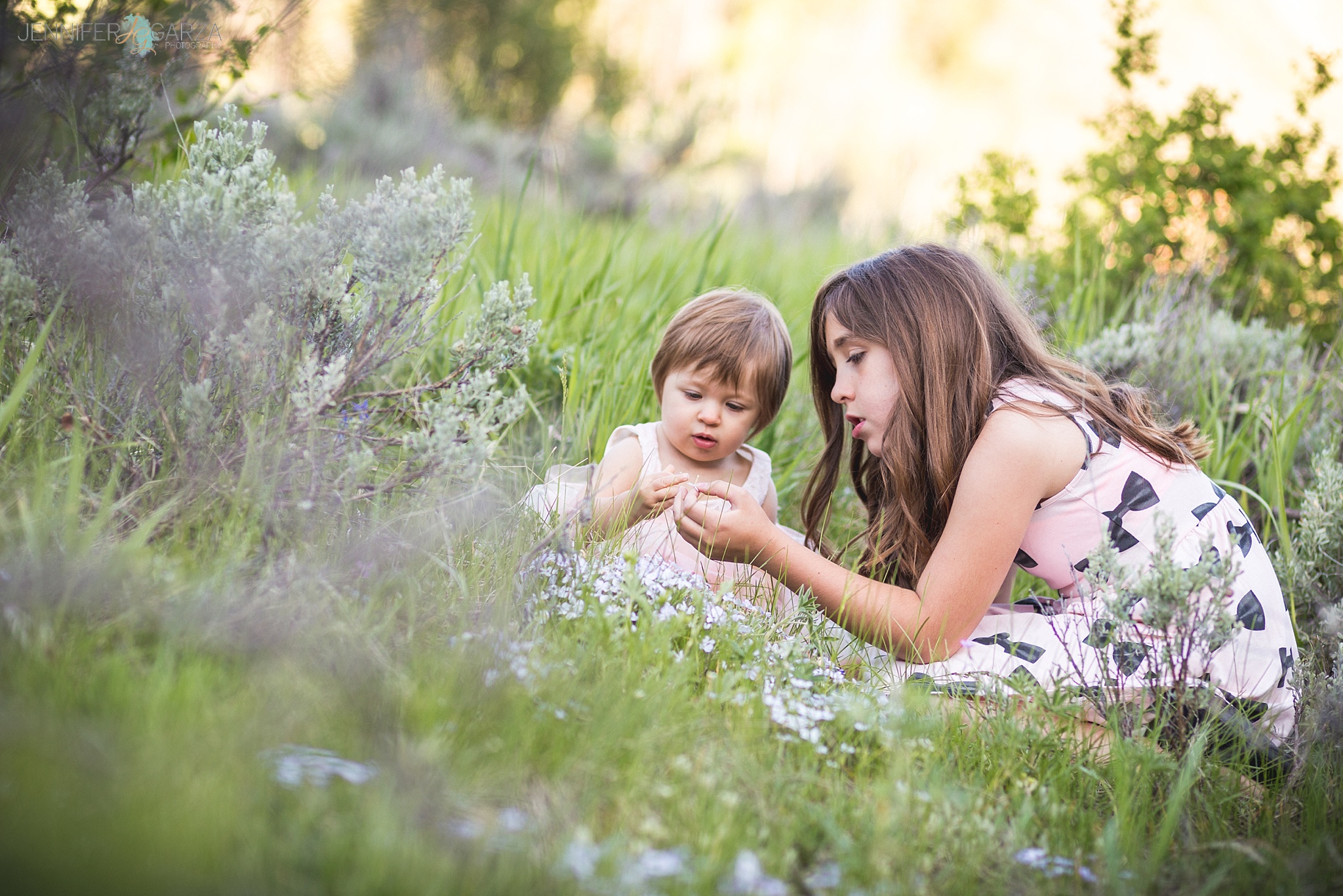 Rhyanne & Savannah picking flowers during their Sylvan Lake family photo session near Vail, Colorado.