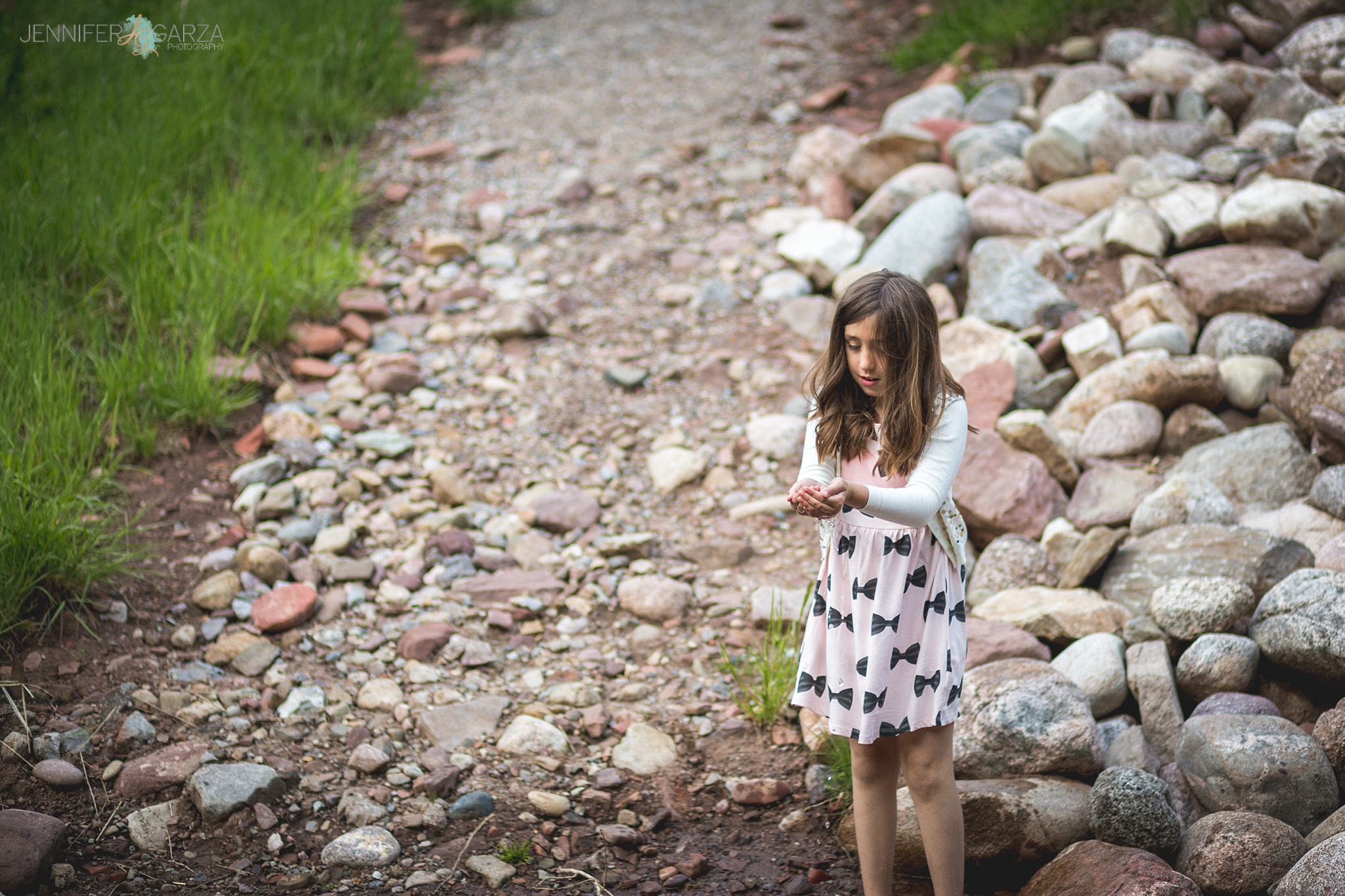 Rhyanne playing in the creek during their Sylvan Lake family photo session.