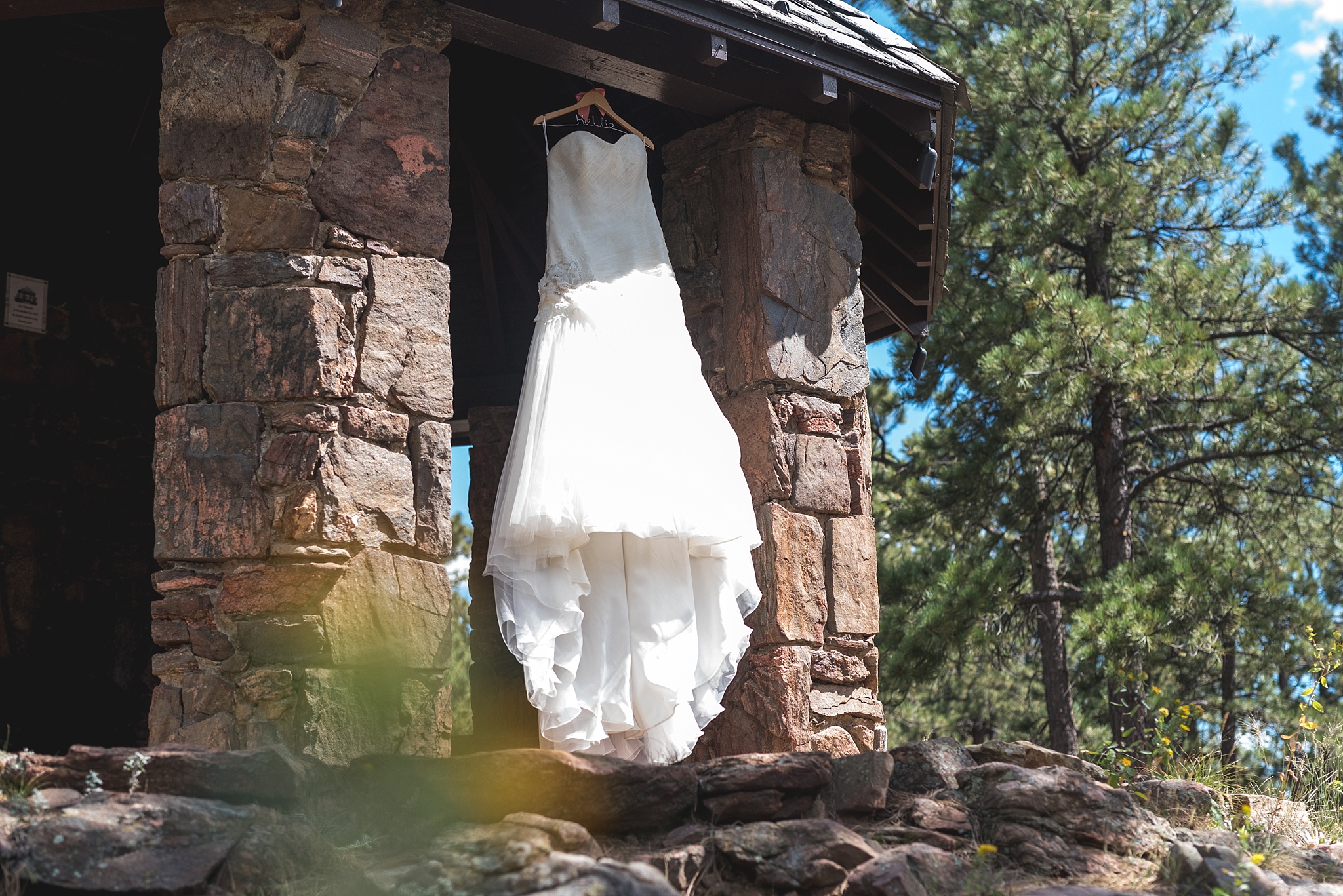 Bride’s dress hanging up in gazebo. Kellie & Brian’s Colorado Mountain Wedding at the historic Boettcher Mansion by Colorado Wedding Photographer, Jennifer Garza. Colorado Wedding Photographer, Colorado Wedding Photography, Colorado Mountain Wedding Photographer, Colorado Mountain Wedding, Mountain Wedding Photographer, Boettcher Mansion Wedding Photographer, Boettcher Mansion Wedding, Mountain Wedding, Lookout Mountain Wedding Photographer, Golden Wedding Photographer, Colorado Bride