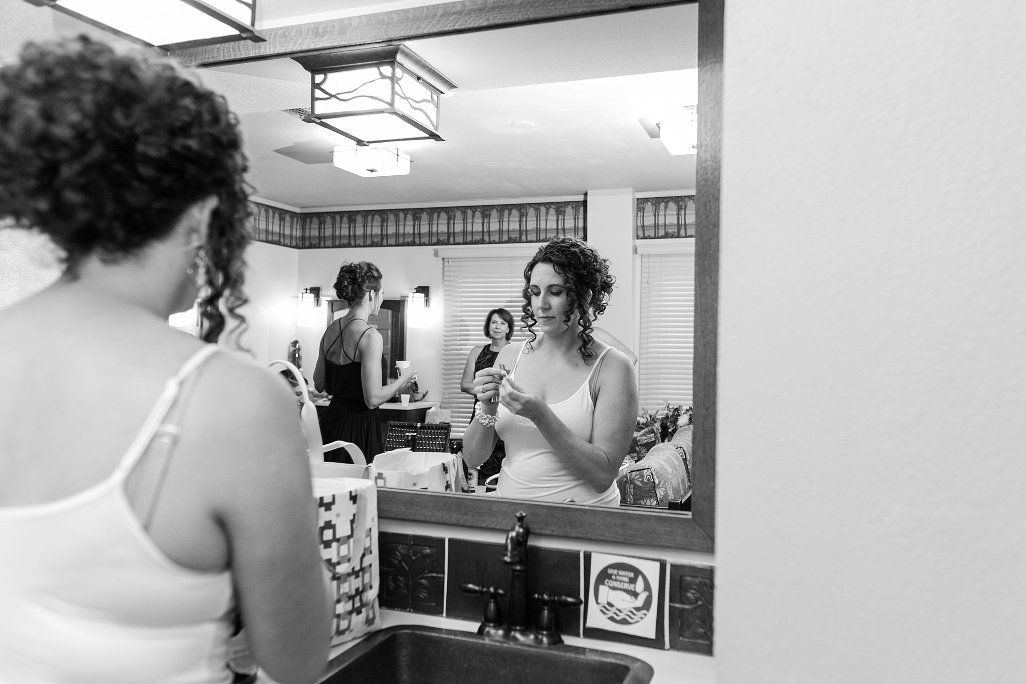 Bride touching up makeup in the mirror. Kellie & Brian’s Colorado Mountain Wedding at the historic Boettcher Mansion by Colorado Wedding Photographer, Jennifer Garza. Colorado Wedding Photographer, Colorado Wedding Photography, Colorado Mountain Wedding Photographer, Colorado Mountain Wedding, Mountain Wedding Photographer, Boettcher Mansion Wedding Photographer, Boettcher Mansion Wedding, Mountain Wedding, Lookout Mountain Wedding Photographer, Golden Wedding Photographer, Colorado Bride