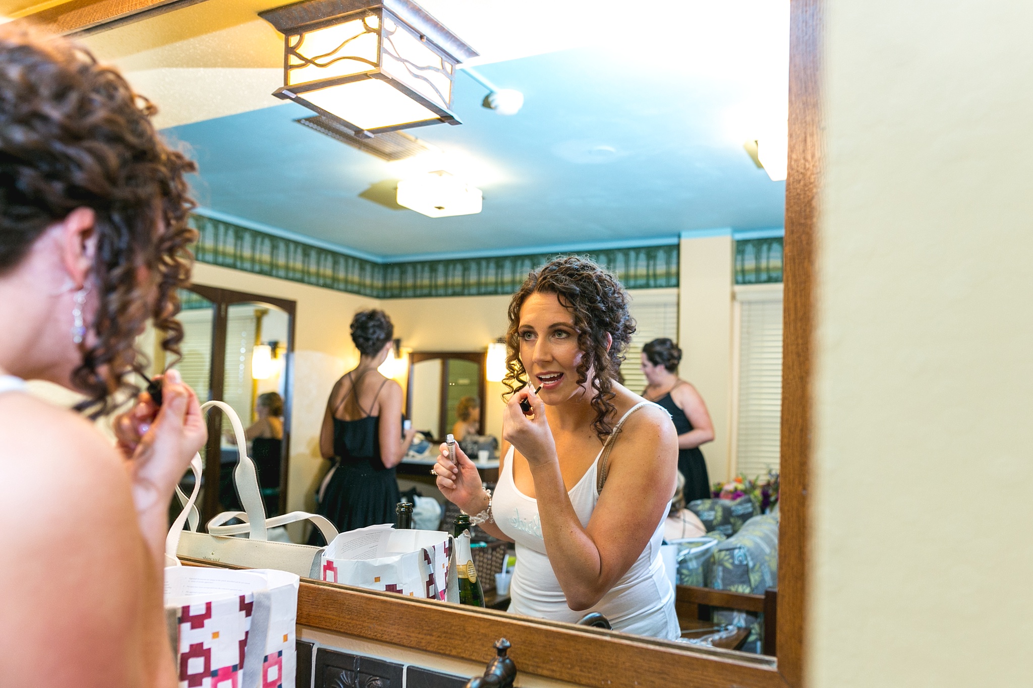 Bride touching up makeup in the mirror. Kellie & Brian’s Colorado Mountain Wedding at the historic Boettcher Mansion by Colorado Wedding Photographer, Jennifer Garza. Colorado Wedding Photographer, Colorado Wedding Photography, Colorado Mountain Wedding Photographer, Colorado Mountain Wedding, Mountain Wedding Photographer, Boettcher Mansion Wedding Photographer, Boettcher Mansion Wedding, Mountain Wedding, Lookout Mountain Wedding Photographer, Golden Wedding Photographer, Colorado Bride