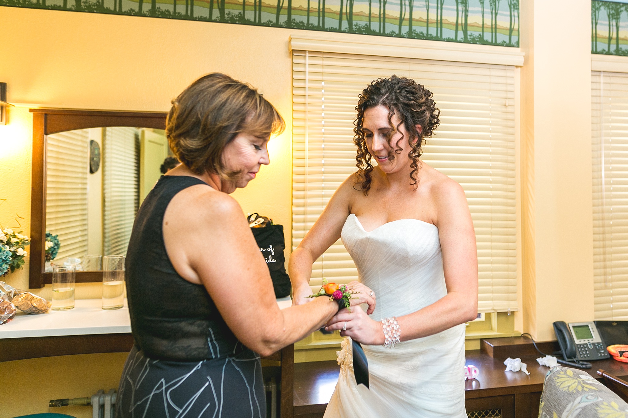 Bride putting corsage on her mother. Kellie & Brian’s Colorado Mountain Wedding at the historic Boettcher Mansion by Colorado Wedding Photographer, Jennifer Garza. Colorado Wedding Photographer, Colorado Wedding Photography, Colorado Mountain Wedding Photographer, Colorado Mountain Wedding, Mountain Wedding Photographer, Boettcher Mansion Wedding Photographer, Boettcher Mansion Wedding, Mountain Wedding, Lookout Mountain Wedding Photographer, Golden Wedding Photographer, Colorado Bride