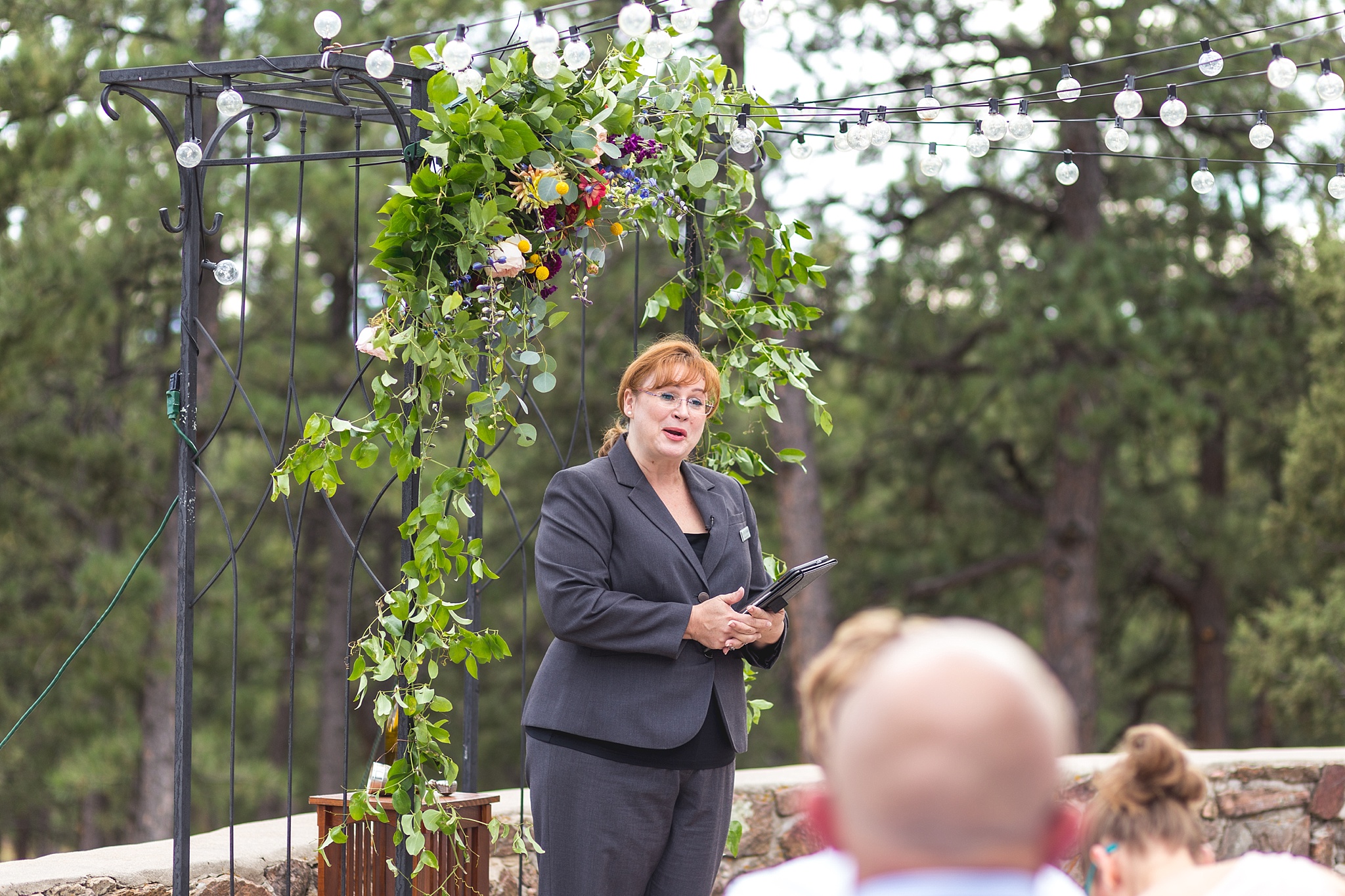 Wedding Officiant making an announcement. Kellie & Brian’s Colorado Mountain Wedding at the historic Boettcher Mansion by Colorado Wedding Photographer, Jennifer Garza. Colorado Wedding Photographer, Colorado Wedding Photography, Colorado Mountain Wedding Photographer, Colorado Mountain Wedding, Mountain Wedding Photographer, Boettcher Mansion Wedding Photographer, Boettcher Mansion Wedding, Mountain Wedding, Lookout Mountain Wedding Photographer, Golden Wedding Photographer, Colorado Bride