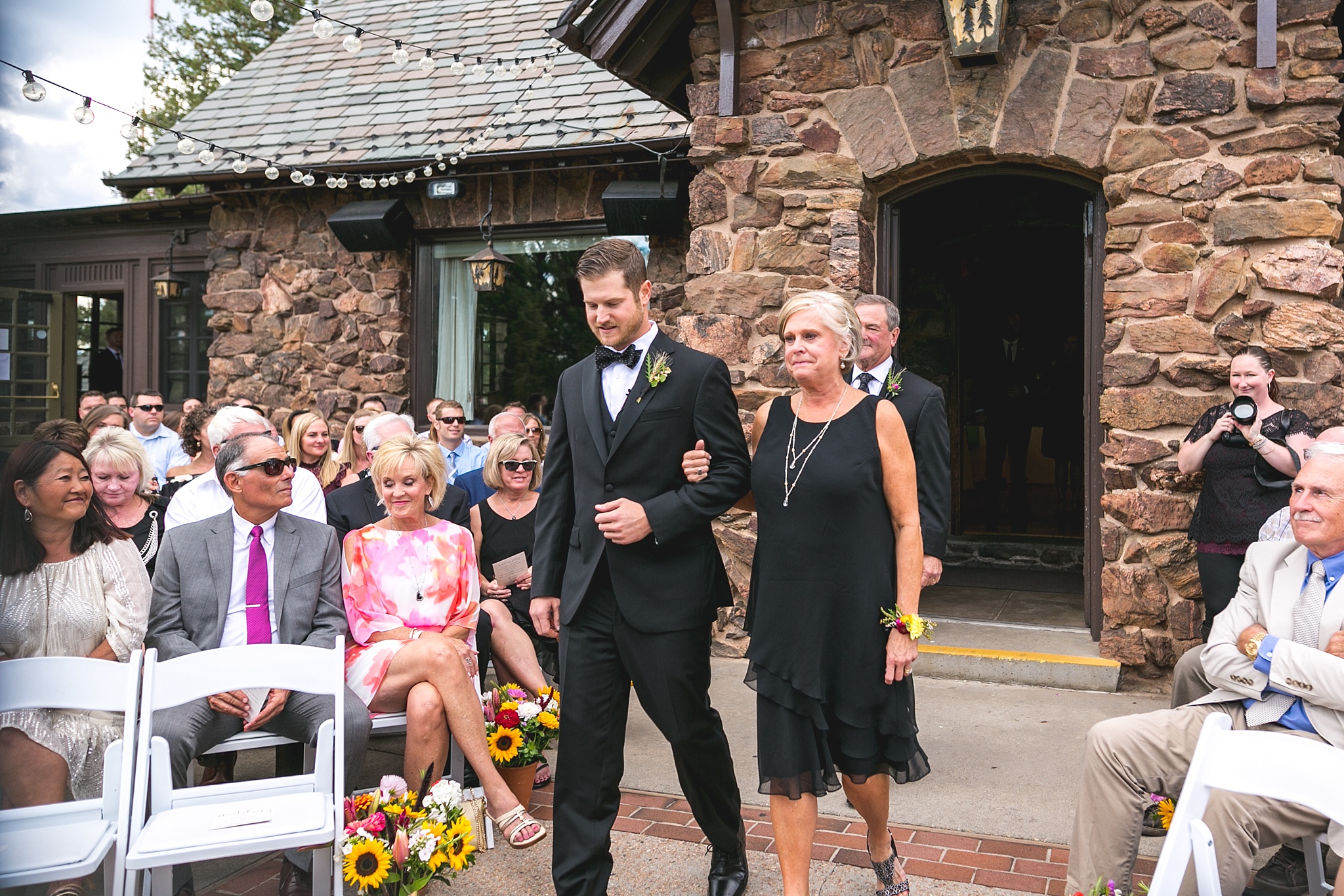 Groom walking his parents down the aisle. Kellie & Brian’s Colorado Mountain Wedding at the historic Boettcher Mansion by Colorado Wedding Photographer, Jennifer Garza. Colorado Wedding Photographer, Colorado Wedding Photography, Colorado Mountain Wedding Photographer, Colorado Mountain Wedding, Mountain Wedding Photographer, Boettcher Mansion Wedding Photographer, Boettcher Mansion Wedding, Mountain Wedding, Lookout Mountain Wedding Photographer, Golden Wedding Photographer, Colorado Bride