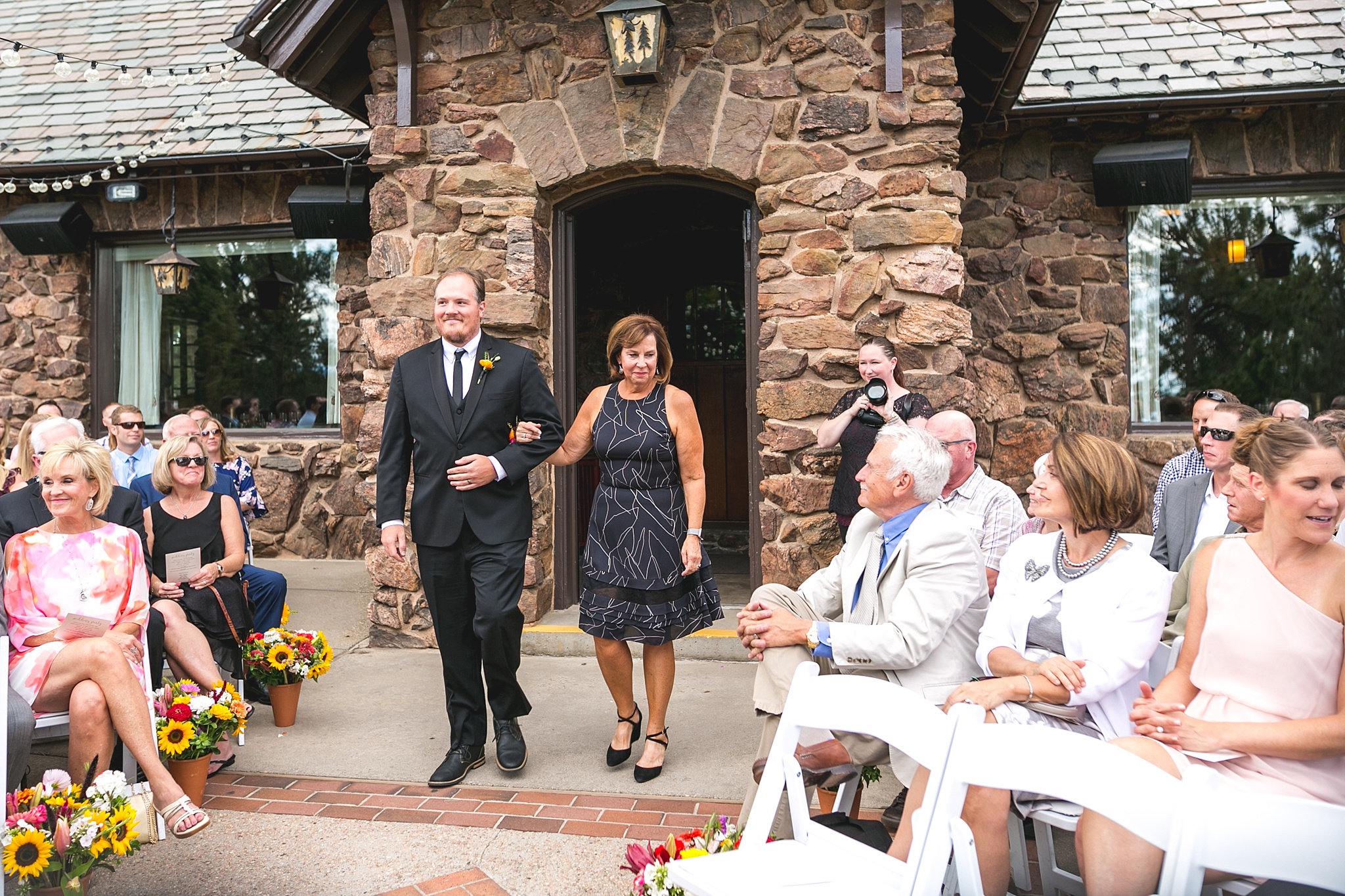 Groomsmen walking mother of bride down the aisle. Kellie & Brian’s Colorado Mountain Wedding at the historic Boettcher Mansion by Colorado Wedding Photographer, Jennifer Garza. Colorado Wedding Photographer, Colorado Wedding Photography, Colorado Mountain Wedding Photographer, Colorado Mountain Wedding, Mountain Wedding Photographer, Boettcher Mansion Wedding Photographer, Boettcher Mansion Wedding, Mountain Wedding, Lookout Mountain Wedding Photographer, Golden Wedding Photographer