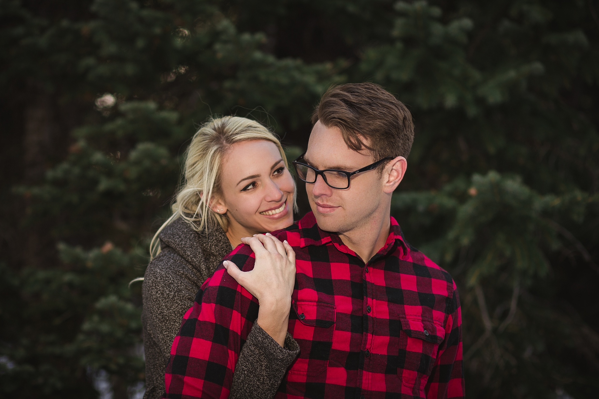 Woman hugging her fiancé from behind during their mountain engagement session. Amy & Jonathan’s Brainard Lake Winter Engagement Session by Colorado Engagement Photographer, Jennifer Garza. Colorado Engagement Photographer, Colorado Engagement Photography, Brainard Lake Engagement Session, Brainard Lake Engagement Photos, Mountain Engagement Session, Colorado Winter Engagement Photos, Winter Engagement Photography, Mountain Engagement Photographer, Colorado Wedding, Colorado Bride, MagMod