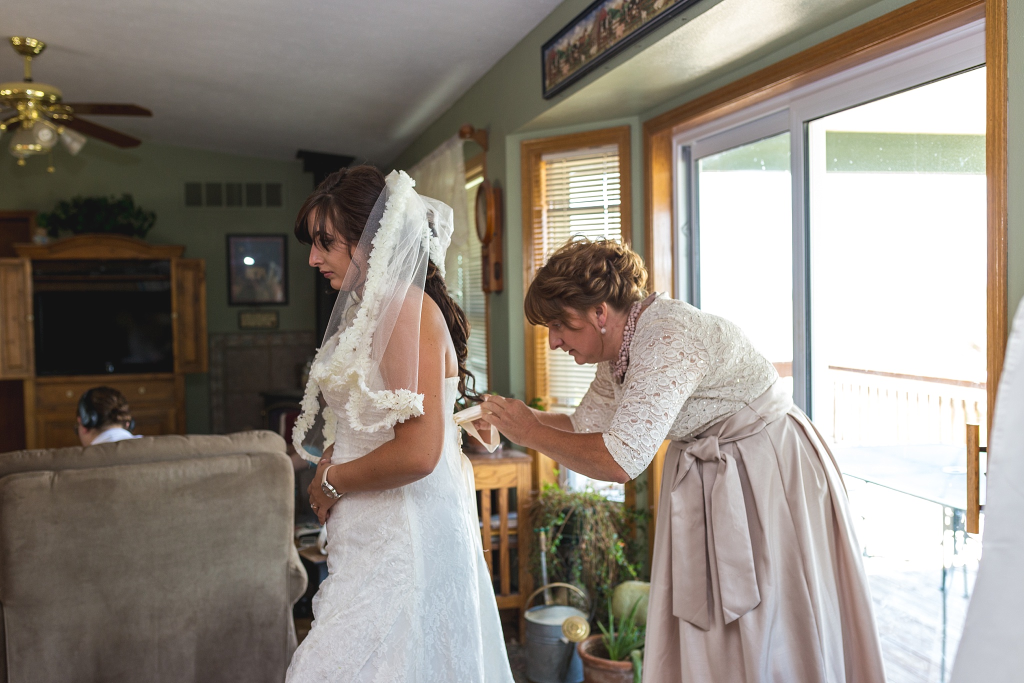 Bride getting ready with her mother. Katie & Jake’s Castle Rock Wedding at the Douglas County Fairgrounds by Colorado Wedding Photographer, Jennifer Garza. Colorado Wedding Photographer, Colorado Wedding Photography, Douglas County Fairgrounds Wedding Photography, Castle Rock Wedding Photography, Castle Rock Wedding Photographer, Colorado Wedding Photography, Colorado Wedding Photographer, Colorado Wedding, Rustic Wedding, Colorado Bride, Rocky Mountain Bride