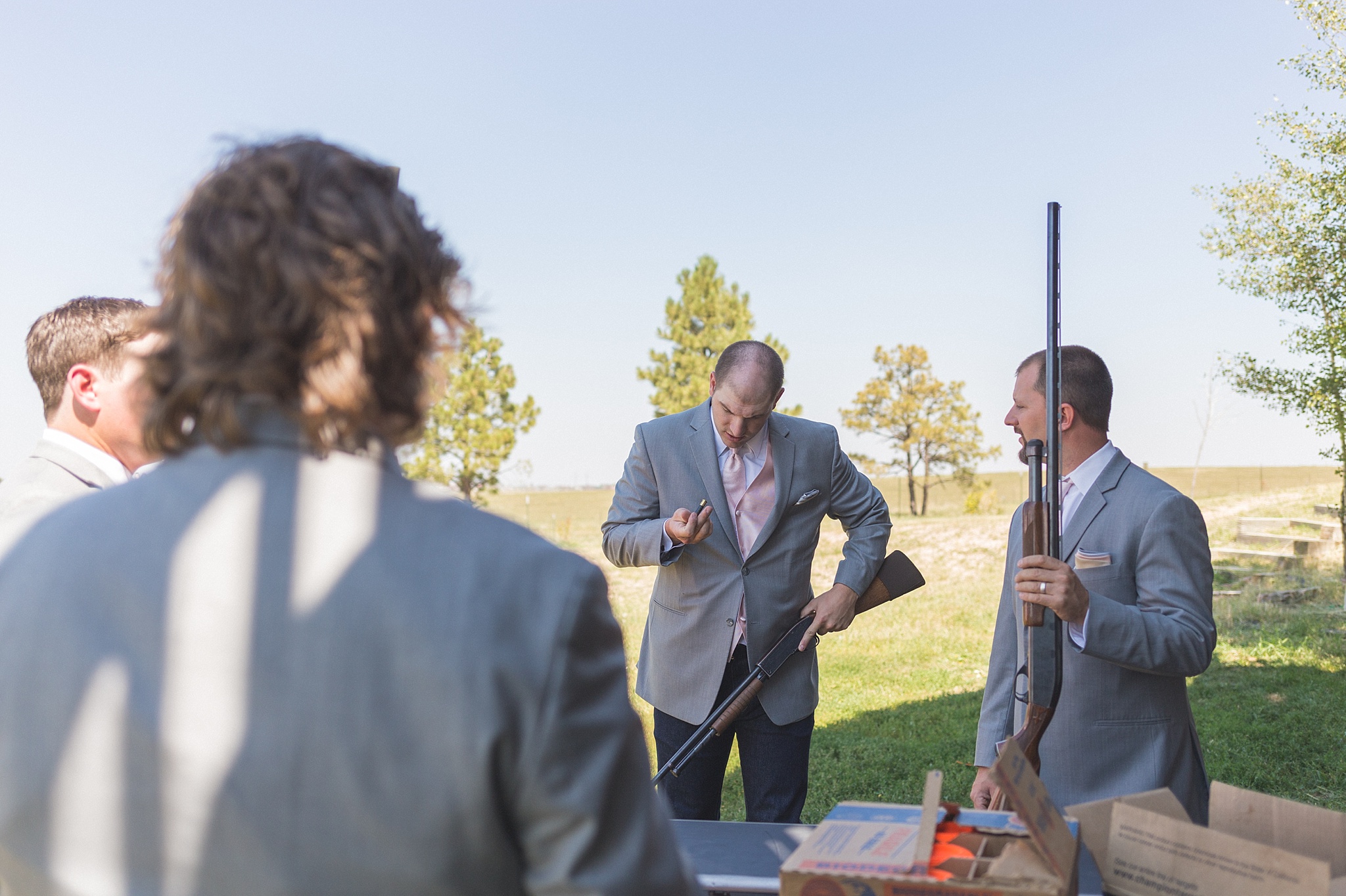 Groomsmen getting ready to shoot some shotguns. Katie & Jake’s Castle Rock Wedding at the Douglas County Fairgrounds by Colorado Wedding Photographer, Jennifer Garza. Colorado Wedding Photographer, Colorado Wedding Photography, Douglas County Fairgrounds Wedding Photography, Castle Rock Wedding Photography, Castle Rock Wedding Photographer, Colorado Wedding Photography, Colorado Wedding Photographer, Colorado Wedding, Rustic Wedding, Colorado Bride, Rocky Mountain Bride