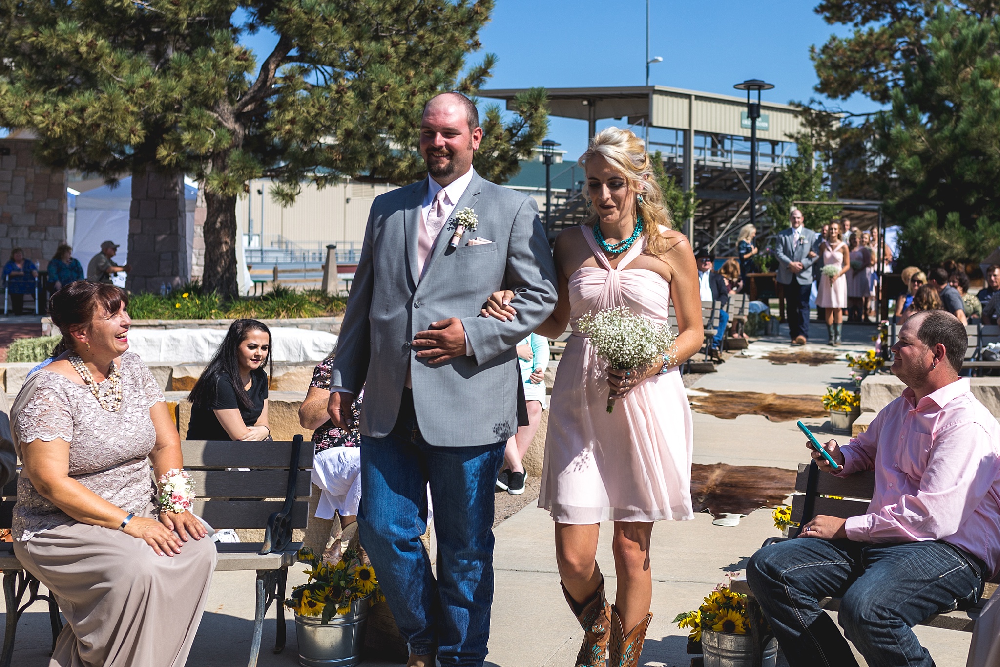 Bridal Party walking down the aisle. Katie & Jake’s Castle Rock Wedding at the Douglas County Fairgrounds by Colorado Wedding Photographer, Jennifer Garza. Colorado Wedding Photographer, Colorado Wedding Photography, Douglas County Fairgrounds Wedding Photography, Castle Rock Wedding Photography, Castle Rock Wedding Photographer, Colorado Wedding Photography, Colorado Wedding Photographer, Colorado Wedding, Rustic Wedding, Colorado Bride, Rocky Mountain Bride