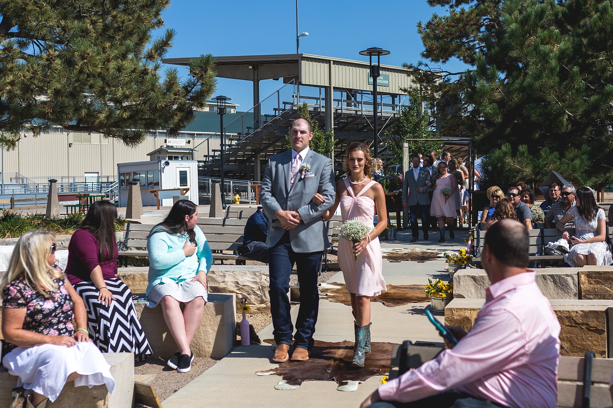 Bridal Party walking down the aisle. Katie & Jake’s Castle Rock Wedding at the Douglas County Fairgrounds by Colorado Wedding Photographer, Jennifer Garza. Colorado Wedding Photographer, Colorado Wedding Photography, Douglas County Fairgrounds Wedding Photography, Castle Rock Wedding Photography, Castle Rock Wedding Photographer, Colorado Wedding Photography, Colorado Wedding Photographer, Colorado Wedding, Rustic Wedding, Colorado Bride, Rocky Mountain Bride