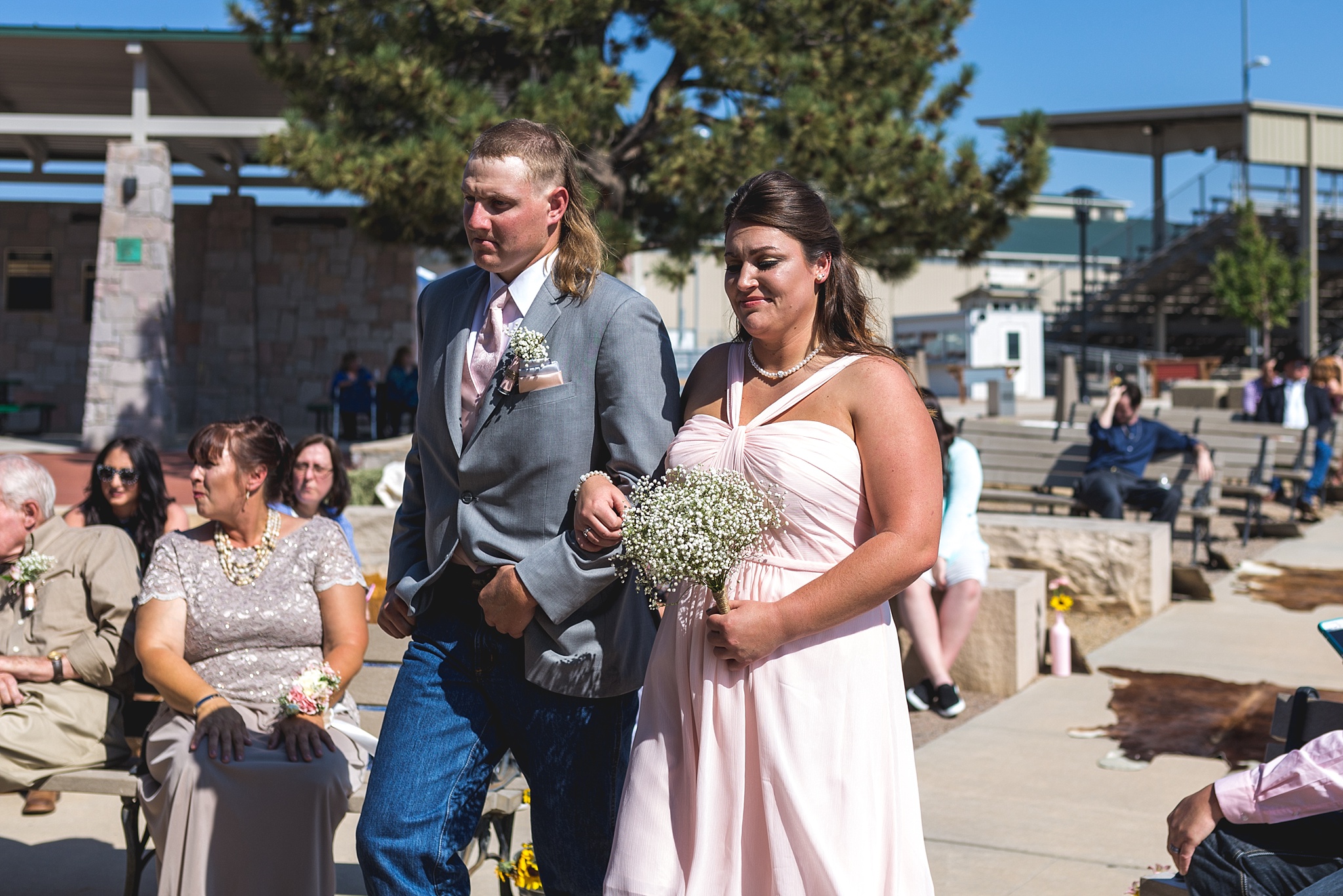 Bridal Party walking down the aisle. Katie & Jake’s Castle Rock Wedding at the Douglas County Fairgrounds by Colorado Wedding Photographer, Jennifer Garza. Colorado Wedding Photographer, Colorado Wedding Photography, Douglas County Fairgrounds Wedding Photography, Castle Rock Wedding Photography, Castle Rock Wedding Photographer, Colorado Wedding Photography, Colorado Wedding Photographer, Colorado Wedding, Rustic Wedding, Colorado Bride, Rocky Mountain Bride