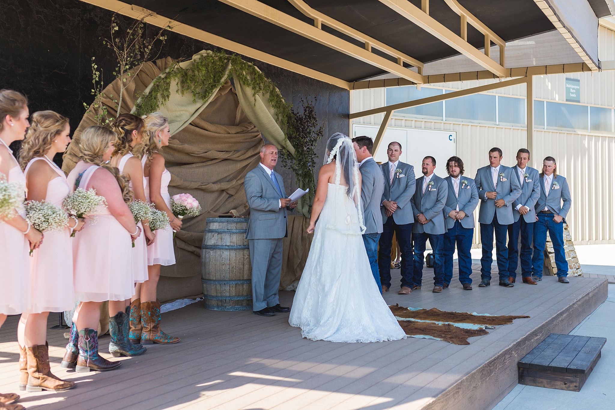 Bride & Groom exchanging vows during the ceremony. Katie & Jake’s Castle Rock Wedding at the Douglas County Fairgrounds by Colorado Wedding Photographer, Jennifer Garza. Colorado Wedding Photographer, Colorado Wedding Photography, Douglas County Fairgrounds Wedding Photography, Castle Rock Wedding Photography, Castle Rock Wedding Photographer, Colorado Wedding Photography, Colorado Wedding Photographer, Colorado Wedding, Rustic Wedding, Colorado Bride, Rocky Mountain Bride