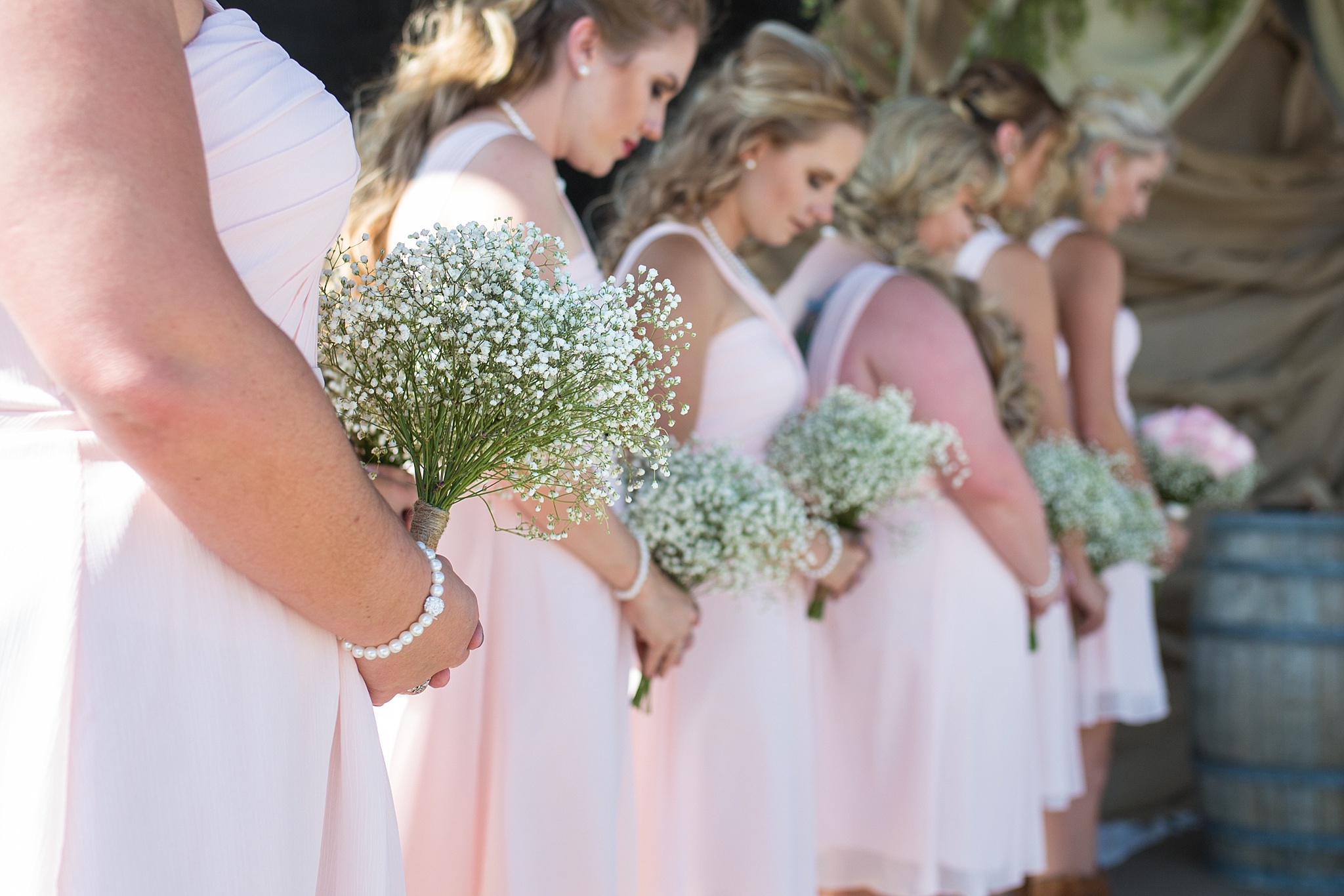 Bridesmaids bouquets during the ceremony. Katie & Jake’s Castle Rock Wedding at the Douglas County Fairgrounds by Colorado Wedding Photographer, Jennifer Garza. Colorado Wedding Photographer, Colorado Wedding Photography, Douglas County Fairgrounds Wedding Photography, Castle Rock Wedding Photography, Castle Rock Wedding Photographer, Colorado Wedding Photography, Colorado Wedding Photographer, Colorado Wedding, Rustic Wedding, Colorado Bride, Rocky Mountain Bride