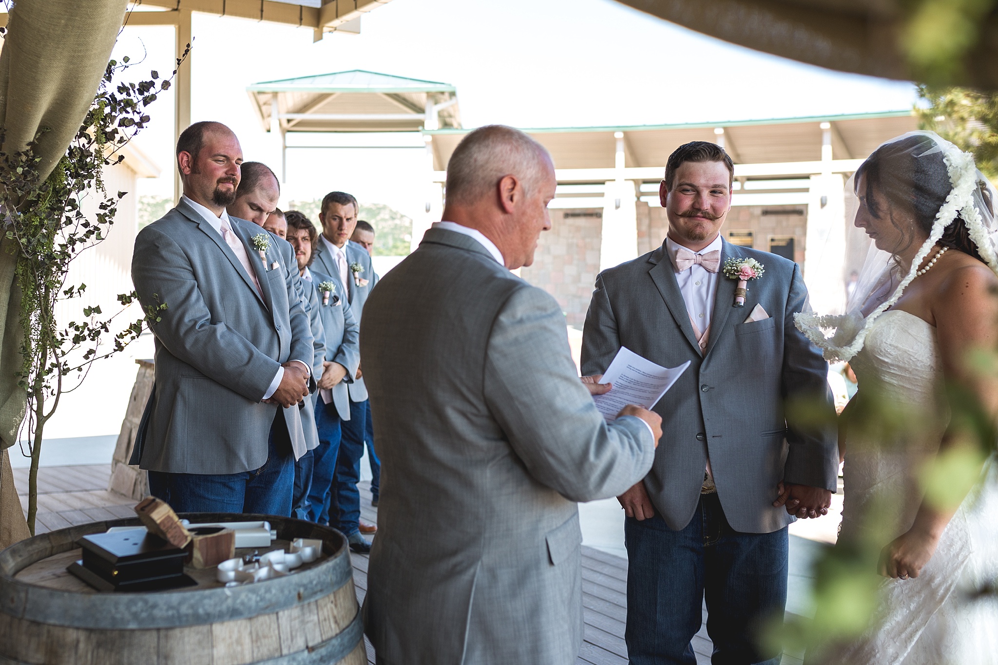 Bride & Groom exchanging vows during the ceremony. Katie & Jake’s Castle Rock Wedding at the Douglas County Fairgrounds by Colorado Wedding Photographer, Jennifer Garza. Colorado Wedding Photographer, Colorado Wedding Photography, Douglas County Fairgrounds Wedding Photography, Castle Rock Wedding Photography, Castle Rock Wedding Photographer, Colorado Wedding Photography, Colorado Wedding Photographer, Colorado Wedding, Rustic Wedding, Colorado Bride, Rocky Mountain Bride