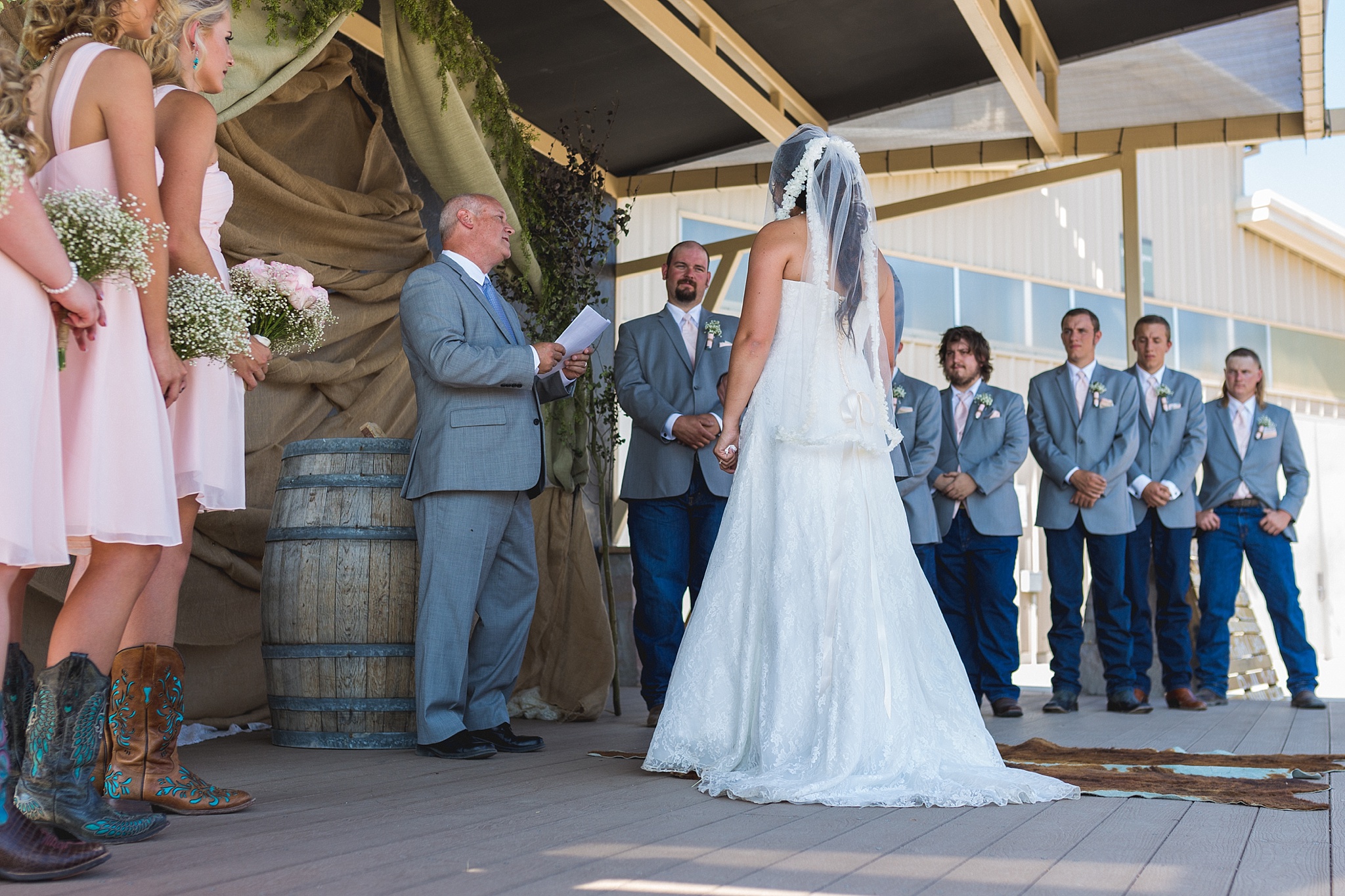 Bride & Groom exchanging vows during the ceremony. Katie & Jake’s Castle Rock Wedding at the Douglas County Fairgrounds by Colorado Wedding Photographer, Jennifer Garza. Colorado Wedding Photographer, Colorado Wedding Photography, Douglas County Fairgrounds Wedding Photography, Castle Rock Wedding Photography, Castle Rock Wedding Photographer, Colorado Wedding Photography, Colorado Wedding Photographer, Colorado Wedding, Rustic Wedding, Colorado Bride, Rocky Mountain Bride