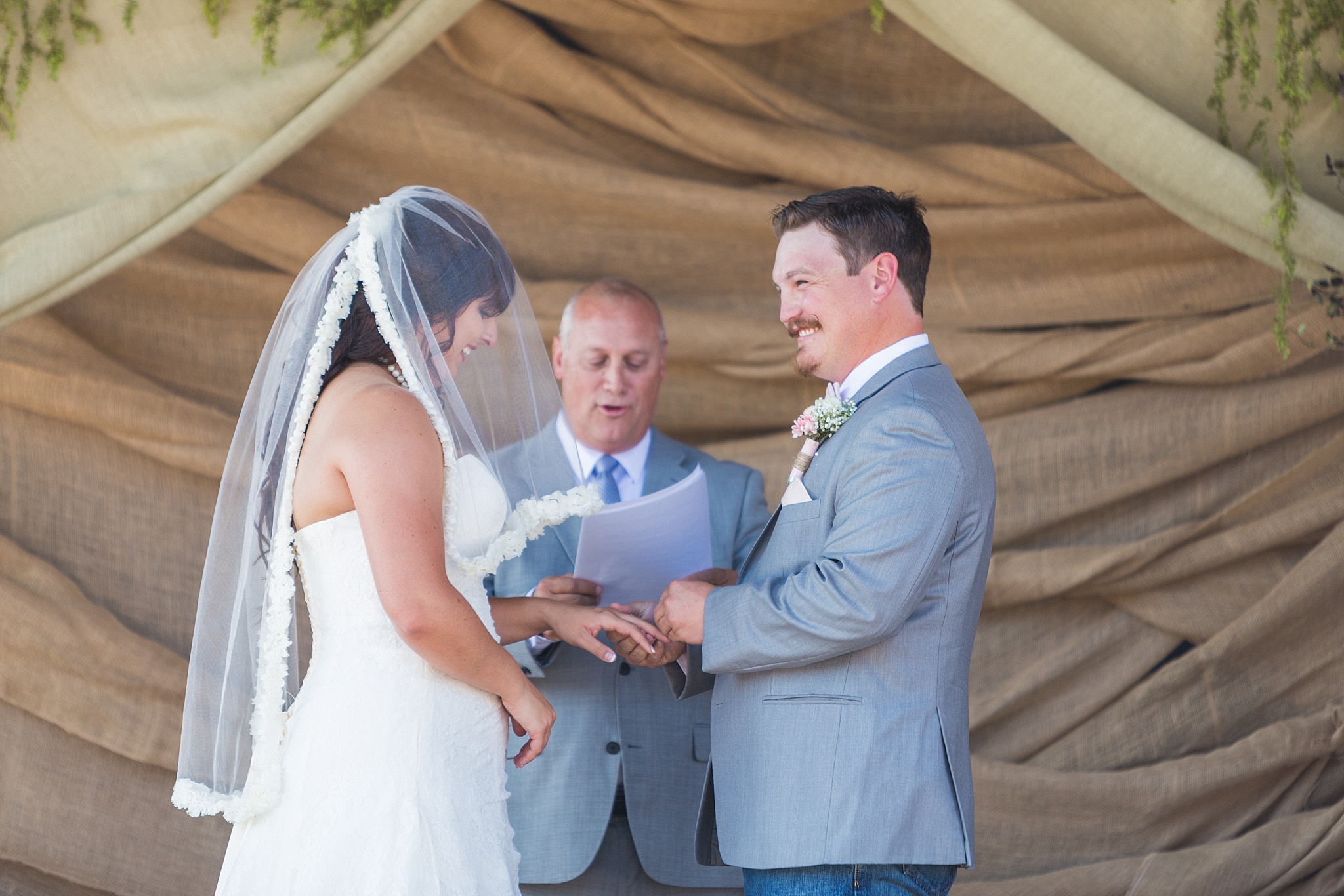 Bride & Groom exchanging rings during the ceremony. Katie & Jake’s Castle Rock Wedding at the Douglas County Fairgrounds by Colorado Wedding Photographer, Jennifer Garza. Colorado Wedding Photographer, Colorado Wedding Photography, Douglas County Fairgrounds Wedding Photography, Castle Rock Wedding Photography, Castle Rock Wedding Photographer, Colorado Wedding Photography, Colorado Wedding Photographer, Colorado Wedding, Rustic Wedding, Colorado Bride, Rocky Mountain Bride