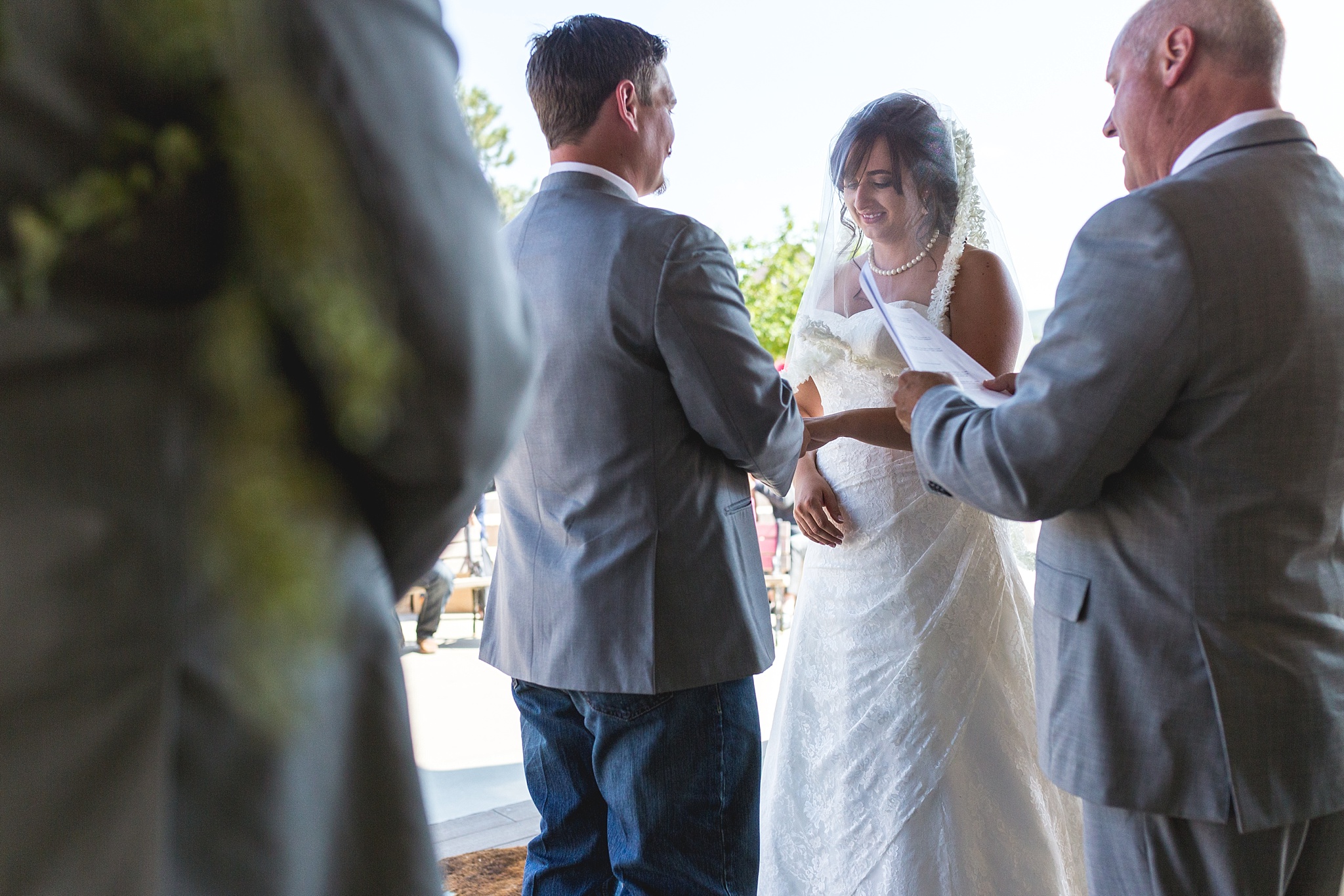 Bride & Groom exchanging rings during the ceremony. Katie & Jake’s Castle Rock Wedding at the Douglas County Fairgrounds by Colorado Wedding Photographer, Jennifer Garza. Colorado Wedding Photographer, Colorado Wedding Photography, Douglas County Fairgrounds Wedding Photography, Castle Rock Wedding Photography, Castle Rock Wedding Photographer, Colorado Wedding Photography, Colorado Wedding Photographer, Colorado Wedding, Rustic Wedding, Colorado Bride, Rocky Mountain Bride