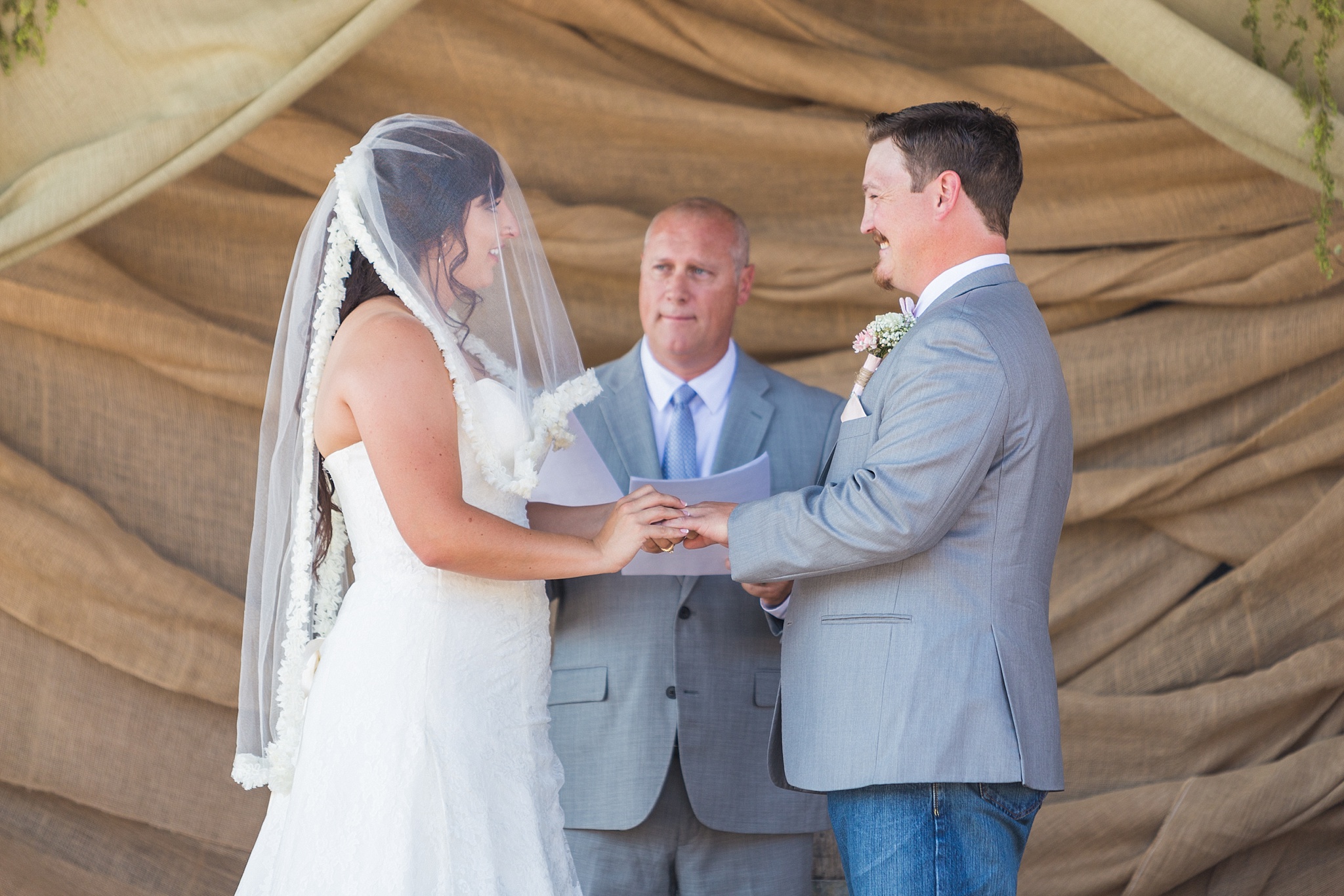 Bride & Groom exchanging rings during the ceremony. Katie & Jake’s Castle Rock Wedding at the Douglas County Fairgrounds by Colorado Wedding Photographer, Jennifer Garza. Colorado Wedding Photographer, Colorado Wedding Photography, Douglas County Fairgrounds Wedding Photography, Castle Rock Wedding Photography, Castle Rock Wedding Photographer, Colorado Wedding Photography, Colorado Wedding Photographer, Colorado Wedding, Rustic Wedding, Colorado Bride, Rocky Mountain Bride