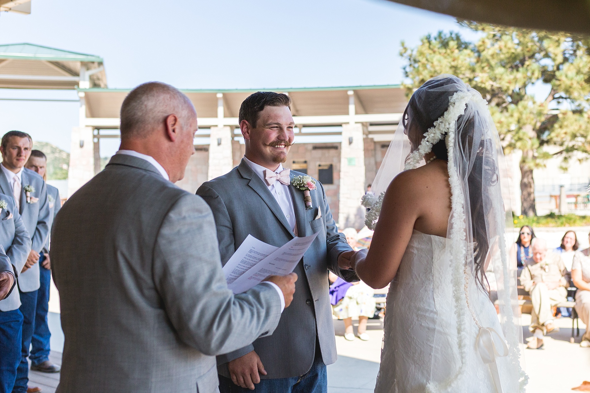 Bride & Groom exchanging rings during the ceremony. Katie & Jake’s Castle Rock Wedding at the Douglas County Fairgrounds by Colorado Wedding Photographer, Jennifer Garza. Colorado Wedding Photographer, Colorado Wedding Photography, Douglas County Fairgrounds Wedding Photography, Castle Rock Wedding Photography, Castle Rock Wedding Photographer, Colorado Wedding Photography, Colorado Wedding Photographer, Colorado Wedding, Rustic Wedding, Colorado Bride, Rocky Mountain Bride