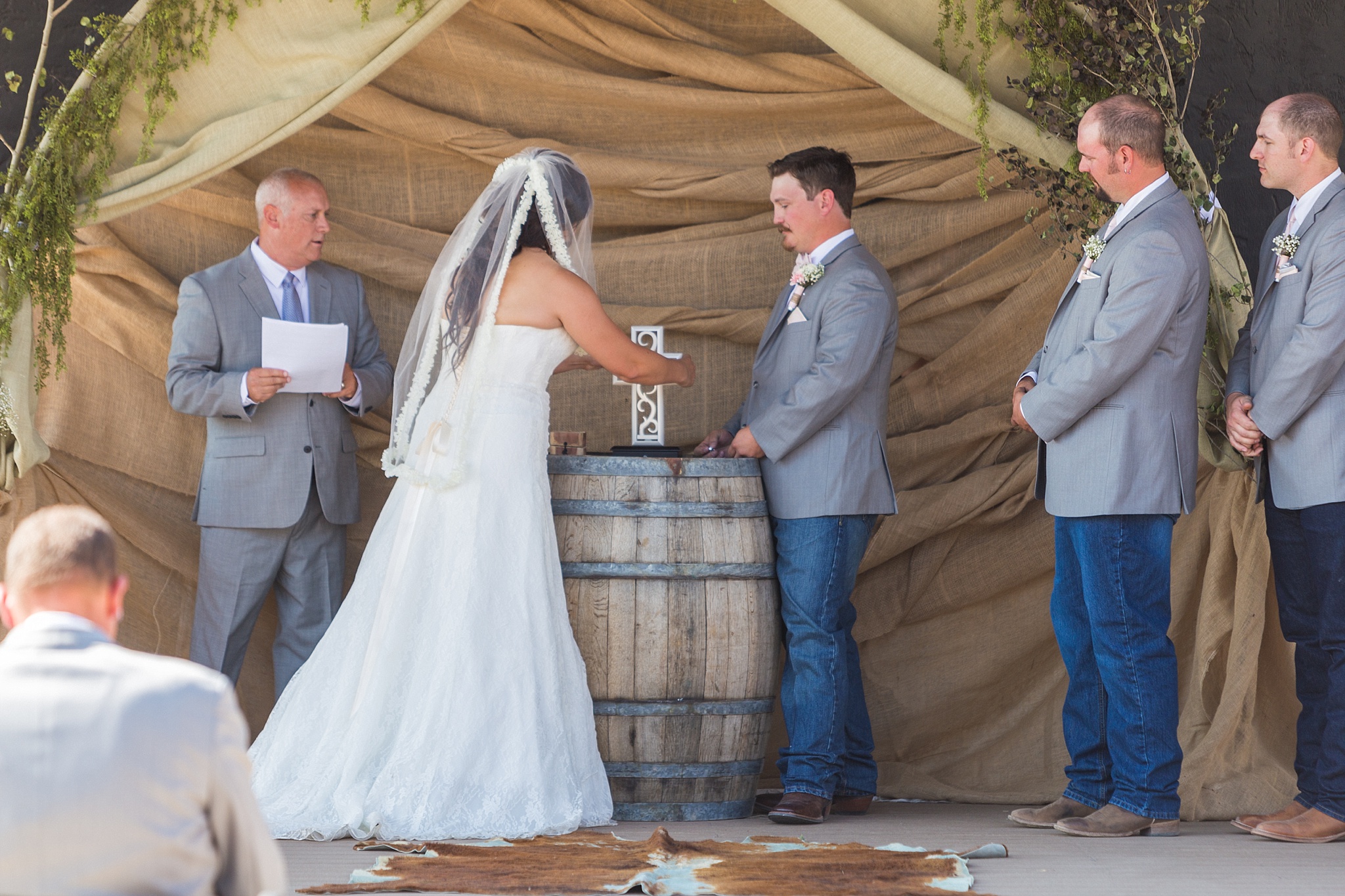 Bride & Groom assembling a cross during the ceremony. Katie & Jake’s Castle Rock Wedding at the Douglas County Fairgrounds by Colorado Wedding Photographer, Jennifer Garza. Colorado Wedding Photographer, Colorado Wedding Photography, Douglas County Fairgrounds Wedding Photography, Castle Rock Wedding Photography, Castle Rock Wedding Photographer, Colorado Wedding Photography, Colorado Wedding Photographer, Colorado Wedding, Rustic Wedding, Colorado Bride, Rocky Mountain Bride