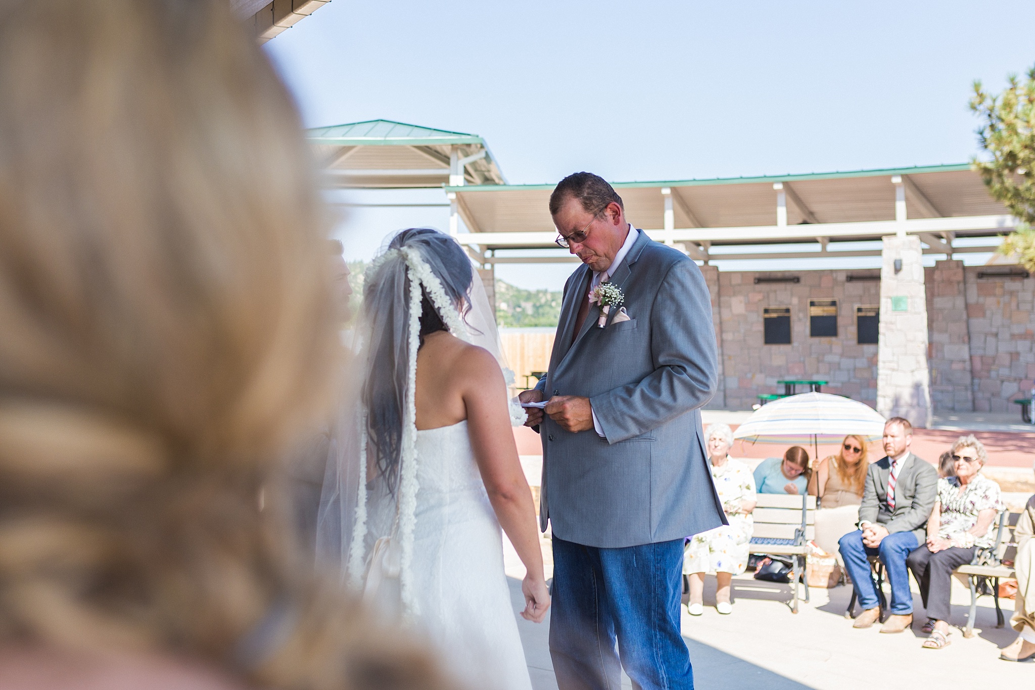 Bride’s father giving a speech during the ceremony. Katie & Jake’s Castle Rock Wedding at the Douglas County Fairgrounds by Colorado Wedding Photographer, Jennifer Garza. Colorado Wedding Photographer, Colorado Wedding Photography, Douglas County Fairgrounds Wedding Photography, Castle Rock Wedding Photography, Castle Rock Wedding Photographer, Colorado Wedding Photography, Colorado Wedding Photographer, Colorado Wedding, Rustic Wedding, Colorado Bride, Rocky Mountain Bride