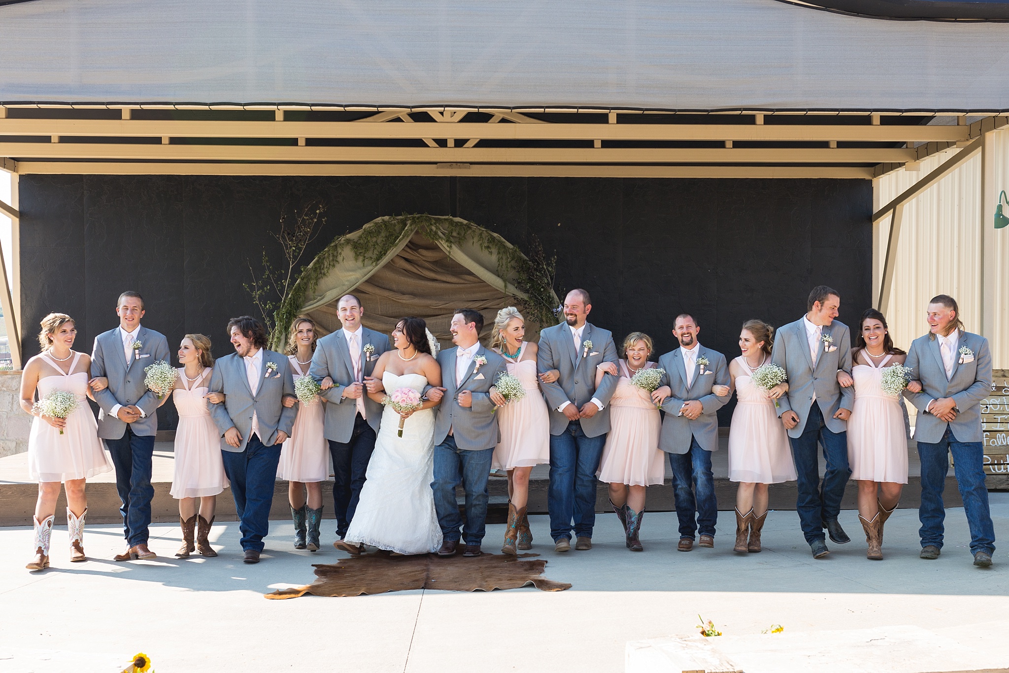 Bridal party walking together. Katie & Jake’s Castle Rock Wedding at the Douglas County Fairgrounds by Colorado Wedding Photographer, Jennifer Garza. Colorado Wedding Photographer, Colorado Wedding Photography, Douglas County Fairgrounds Wedding Photography, Castle Rock Wedding Photography, Castle Rock Wedding Photographer, Colorado Wedding Photography, Colorado Wedding Photographer, Colorado Wedding, Rustic Wedding, Colorado Bride, Rocky Mountain Bride