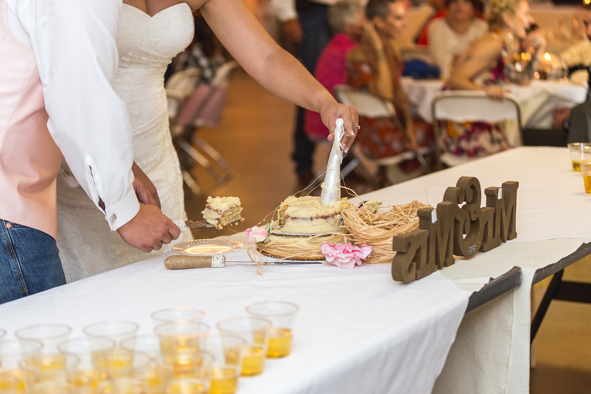 Bride & Groom cutting their cake during the wedding reception. Katie & Jake’s Castle Rock Wedding at the Douglas County Fairgrounds by Colorado Wedding Photographer, Jennifer Garza. Colorado Wedding Photographer, Colorado Wedding Photography, Douglas County Fairgrounds Wedding Photography, Castle Rock Wedding Photography, Castle Rock Wedding Photographer, Colorado Wedding Photography, Colorado Wedding Photographer, Colorado Wedding, Rustic Wedding, Colorado Bride, Rocky Mountain Bride