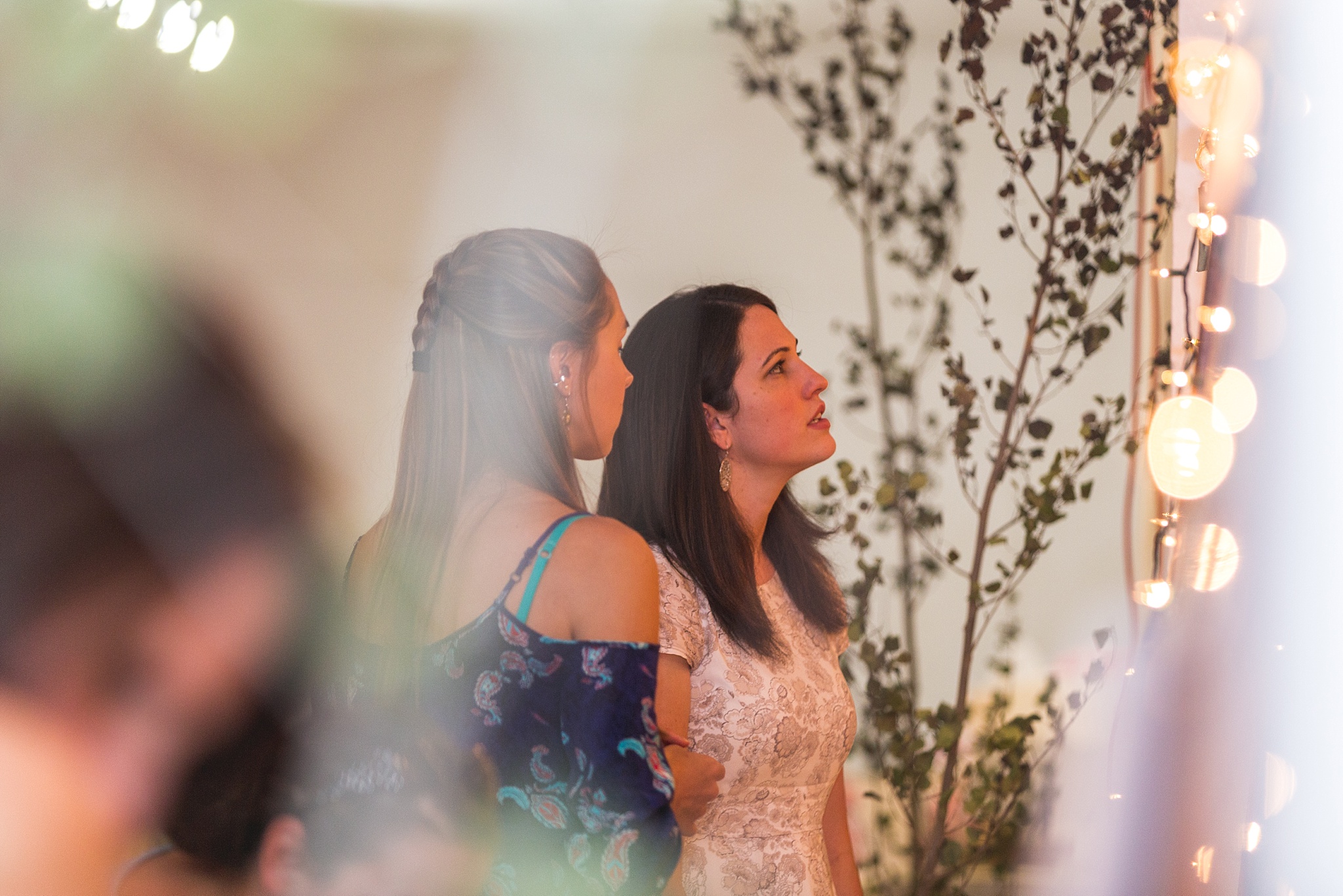 Guests looking at family photos during the wedding reception. Katie & Jake’s Castle Rock Wedding at the Douglas County Fairgrounds by Colorado Wedding Photographer, Jennifer Garza. Colorado Wedding Photographer, Colorado Wedding Photography, Douglas County Fairgrounds Wedding Photography, Castle Rock Wedding Photography, Castle Rock Wedding Photographer, Colorado Wedding Photography, Colorado Wedding Photographer, Colorado Wedding, Rustic Wedding, Colorado Bride, Rocky Mountain Bride