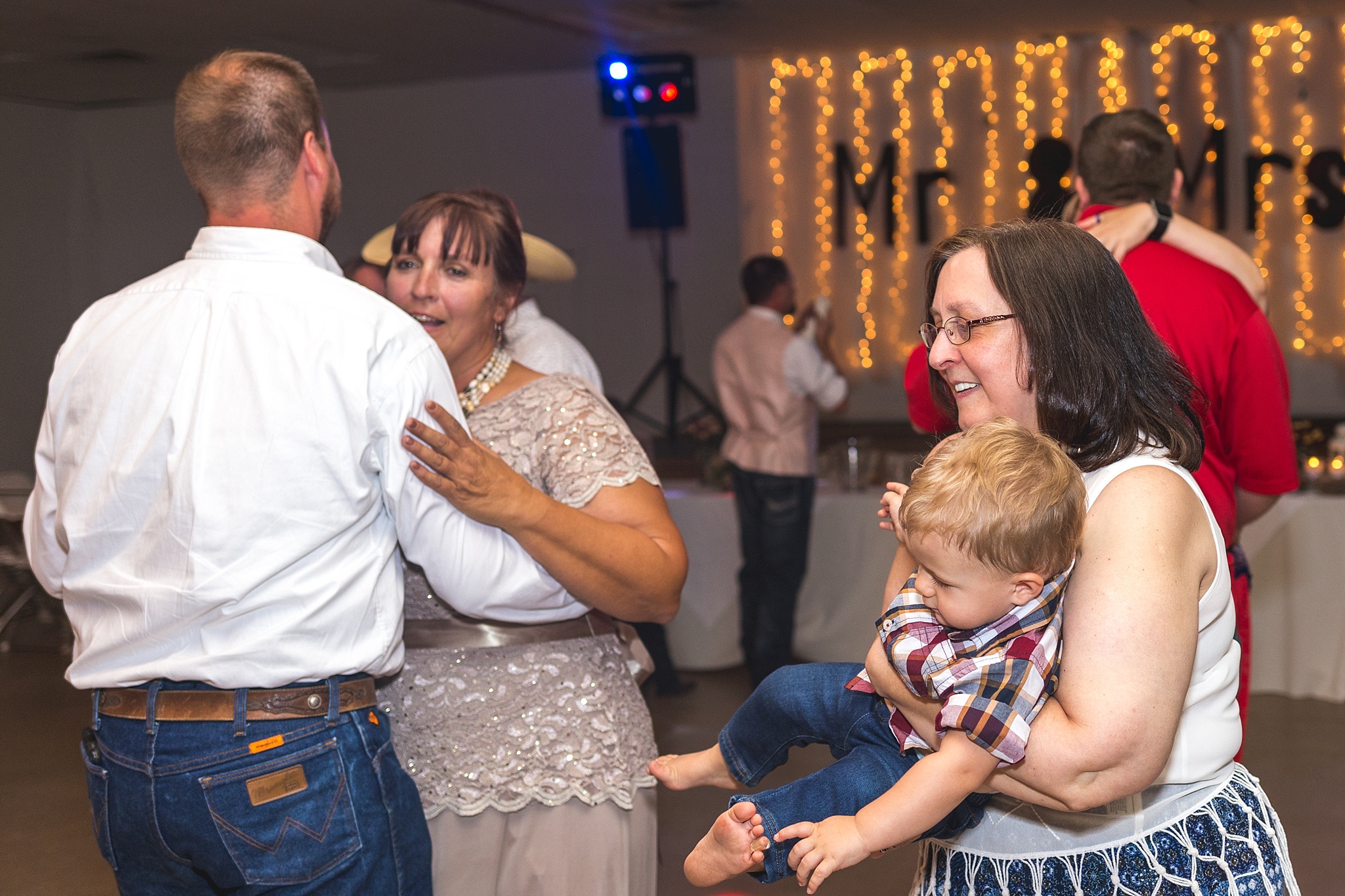 Guests dancing during their wedding reception. Katie & Jake’s Castle Rock Wedding at the Douglas County Fairgrounds by Colorado Wedding Photographer, Jennifer Garza. Colorado Wedding Photographer, Colorado Wedding Photography, Douglas County Fairgrounds Wedding Photography, Castle Rock Wedding Photography, Castle Rock Wedding Photographer, Colorado Wedding Photography, Colorado Wedding Photographer, Colorado Wedding, Rustic Wedding, Colorado Bride, Rocky Mountain Bride