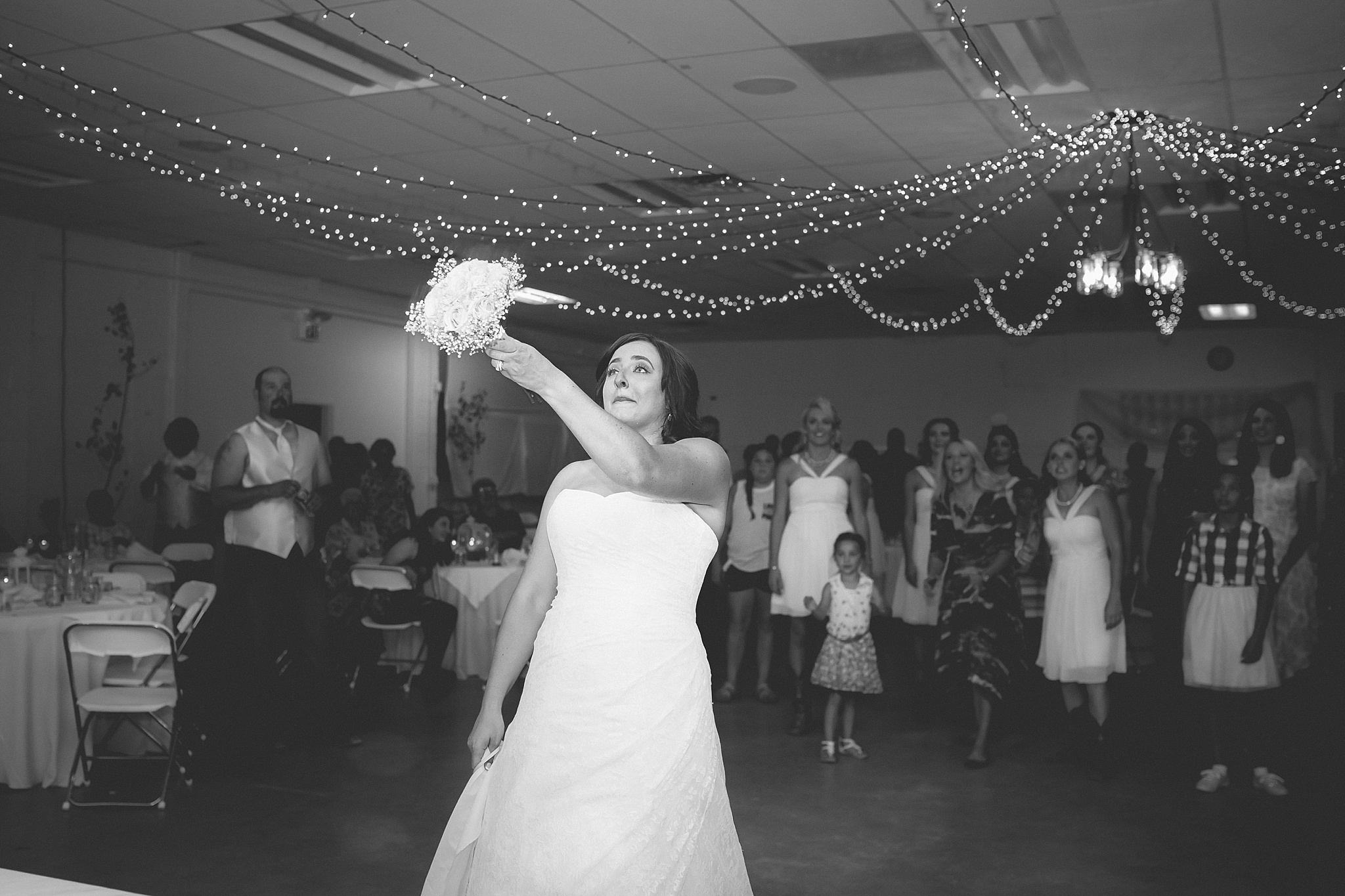 Bride throwing the bouquet at wedding reception. Katie & Jake’s Castle Rock Wedding at the Douglas County Fairgrounds by Colorado Wedding Photographer, Jennifer Garza. Colorado Wedding Photographer, Colorado Wedding Photography, Douglas County Fairgrounds Wedding Photography, Castle Rock Wedding Photography, Castle Rock Wedding Photographer, Colorado Wedding Photography, Colorado Wedding Photographer, Colorado Wedding, Rustic Wedding, Colorado Bride, Rocky Mountain Bride