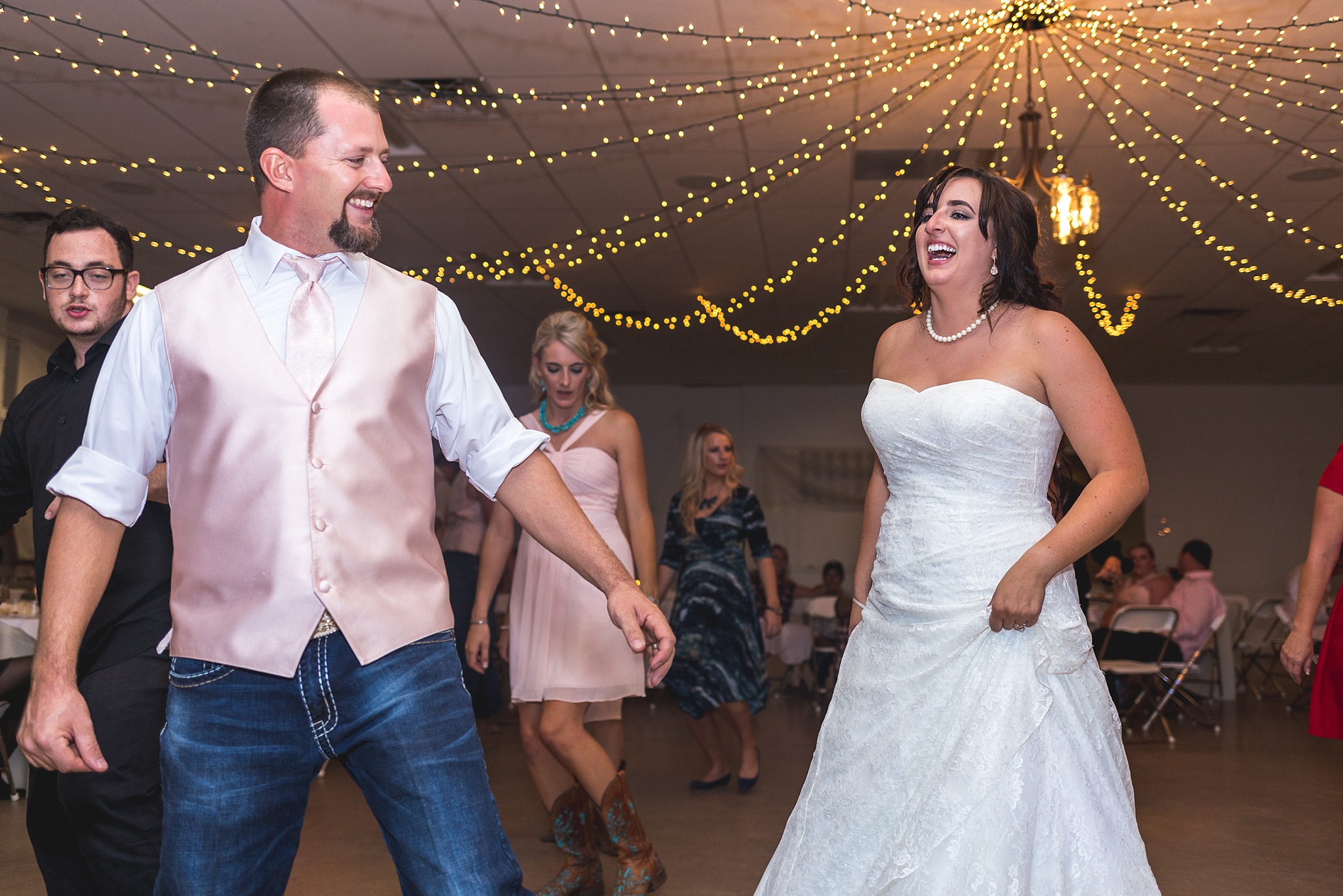 Bride & guests dancing at wedding reception. Katie & Jake’s Castle Rock Wedding at the Douglas County Fairgrounds by Colorado Wedding Photographer, Jennifer Garza. Colorado Wedding Photographer, Colorado Wedding Photography, Douglas County Fairgrounds Wedding Photography, Castle Rock Wedding Photography, Castle Rock Wedding Photographer, Colorado Wedding Photography, Colorado Wedding Photographer, Colorado Wedding, Rustic Wedding, Colorado Bride, Rocky Mountain Bride