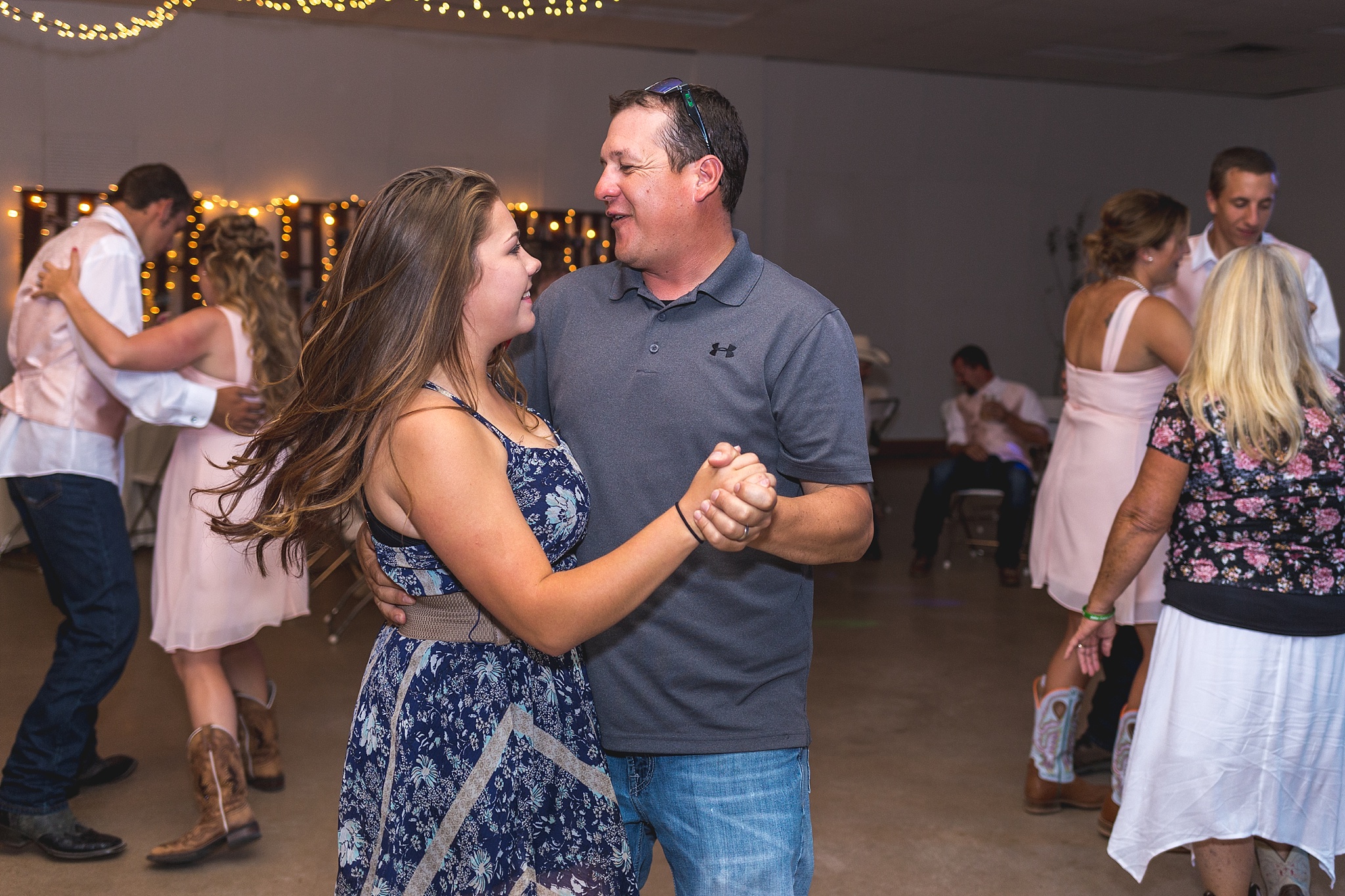 Guests dancing during their wedding reception. Katie & Jake’s Castle Rock Wedding at the Douglas County Fairgrounds by Colorado Wedding Photographer, Jennifer Garza. Colorado Wedding Photographer, Colorado Wedding Photography, Douglas County Fairgrounds Wedding Photography, Castle Rock Wedding Photography, Castle Rock Wedding Photographer, Colorado Wedding Photography, Colorado Wedding Photographer, Colorado Wedding, Rustic Wedding, Colorado Bride, Rocky Mountain Bride