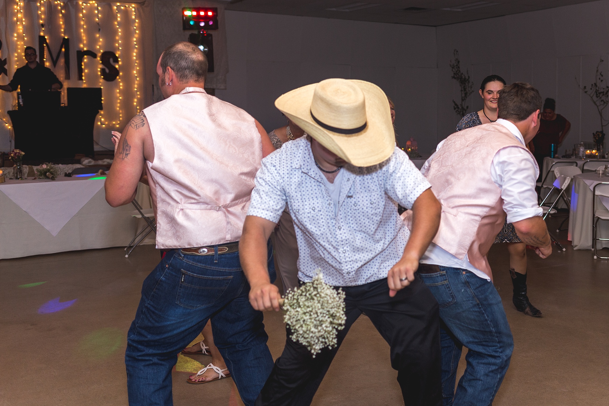 Guests dancing during their wedding reception. Katie & Jake’s Castle Rock Wedding at the Douglas County Fairgrounds by Colorado Wedding Photographer, Jennifer Garza. Colorado Wedding Photographer, Colorado Wedding Photography, Douglas County Fairgrounds Wedding Photography, Castle Rock Wedding Photography, Castle Rock Wedding Photographer, Colorado Wedding Photography, Colorado Wedding Photographer, Colorado Wedding, Rustic Wedding, Colorado Bride, Rocky Mountain Bride