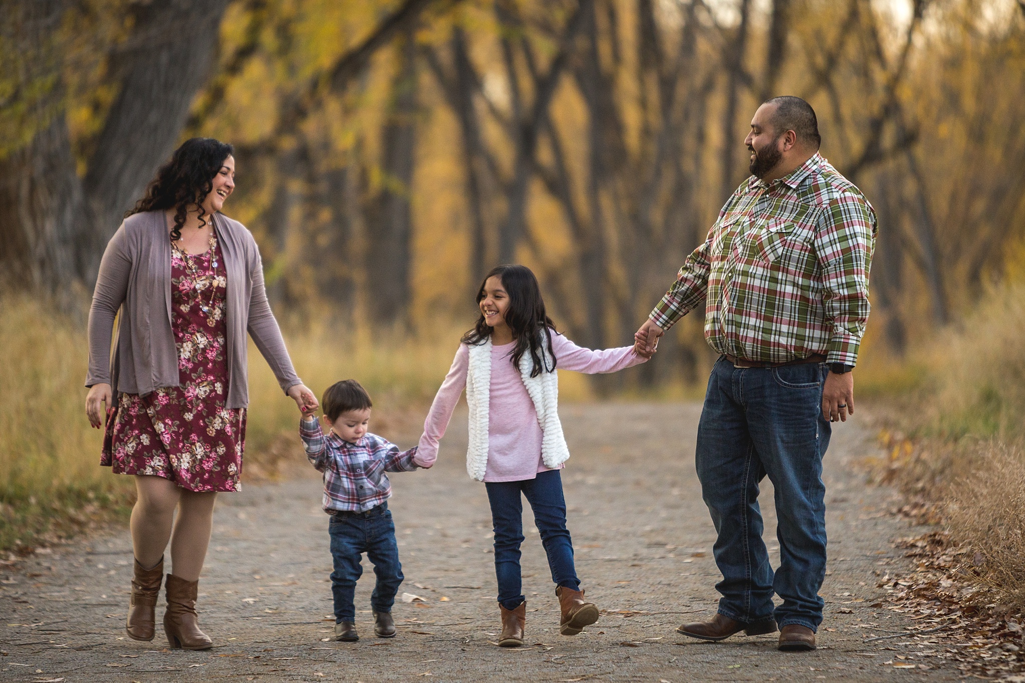 Cute family walking during fall family portraits. The Aguayo Family’s Fall Family Photo Session at Golden Ponds Nature Area by Colorado Family Photographer, Jennifer Garza. Golden Ponds Nature Area Family Photographer, Golden Ponds Nature Area, Golden Ponds, Golden Ponds Family Photographer, Longmont Family Photography, Longmont Family Photographer, Colorado Family Photos, Colorado Family Photographer, Colorado Fall Photos, Fall Photos