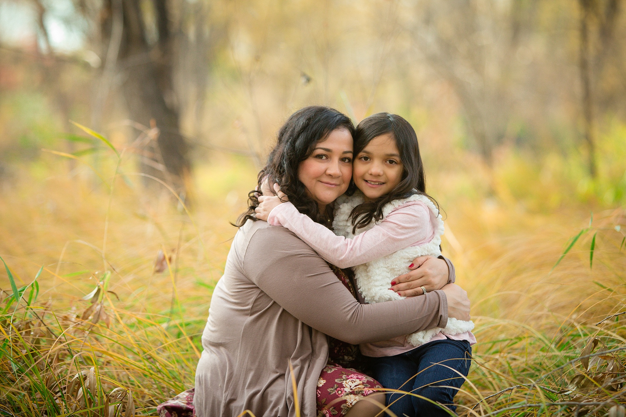 Mother & daughter hugging during fall family portraits. The Aguayo Family’s Fall Family Photo Session at Golden Ponds Nature Area by Colorado Family Photographer, Jennifer Garza. Golden Ponds Nature Area Family Photographer, Golden Ponds Nature Area, Golden Ponds, Golden Ponds Family Photographer, Longmont Family Photography, Longmont Family Photographer, Colorado Family Photos, Colorado Family Photographer, Colorado Fall Photos, Fall Photos