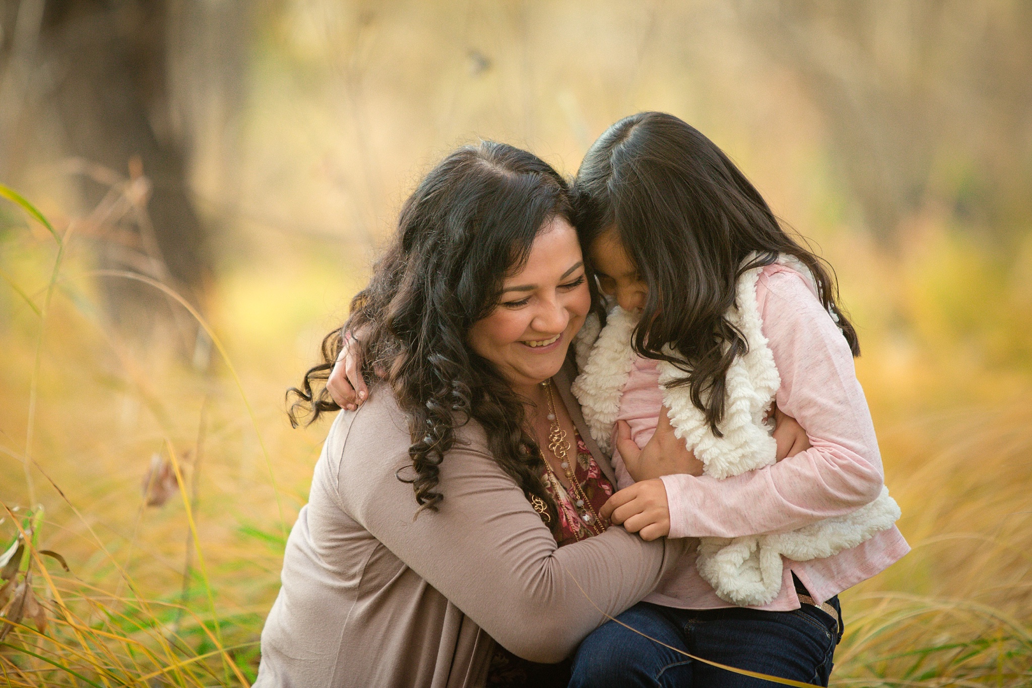 Mother & daughter hugging during fall family portraits. The Aguayo Family’s Fall Family Photo Session at Golden Ponds Nature Area by Colorado Family Photographer, Jennifer Garza. Golden Ponds Nature Area Family Photographer, Golden Ponds Nature Area, Golden Ponds, Golden Ponds Family Photographer, Longmont Family Photography, Longmont Family Photographer, Colorado Family Photos, Colorado Family Photographer, Colorado Fall Photos, Fall Photos