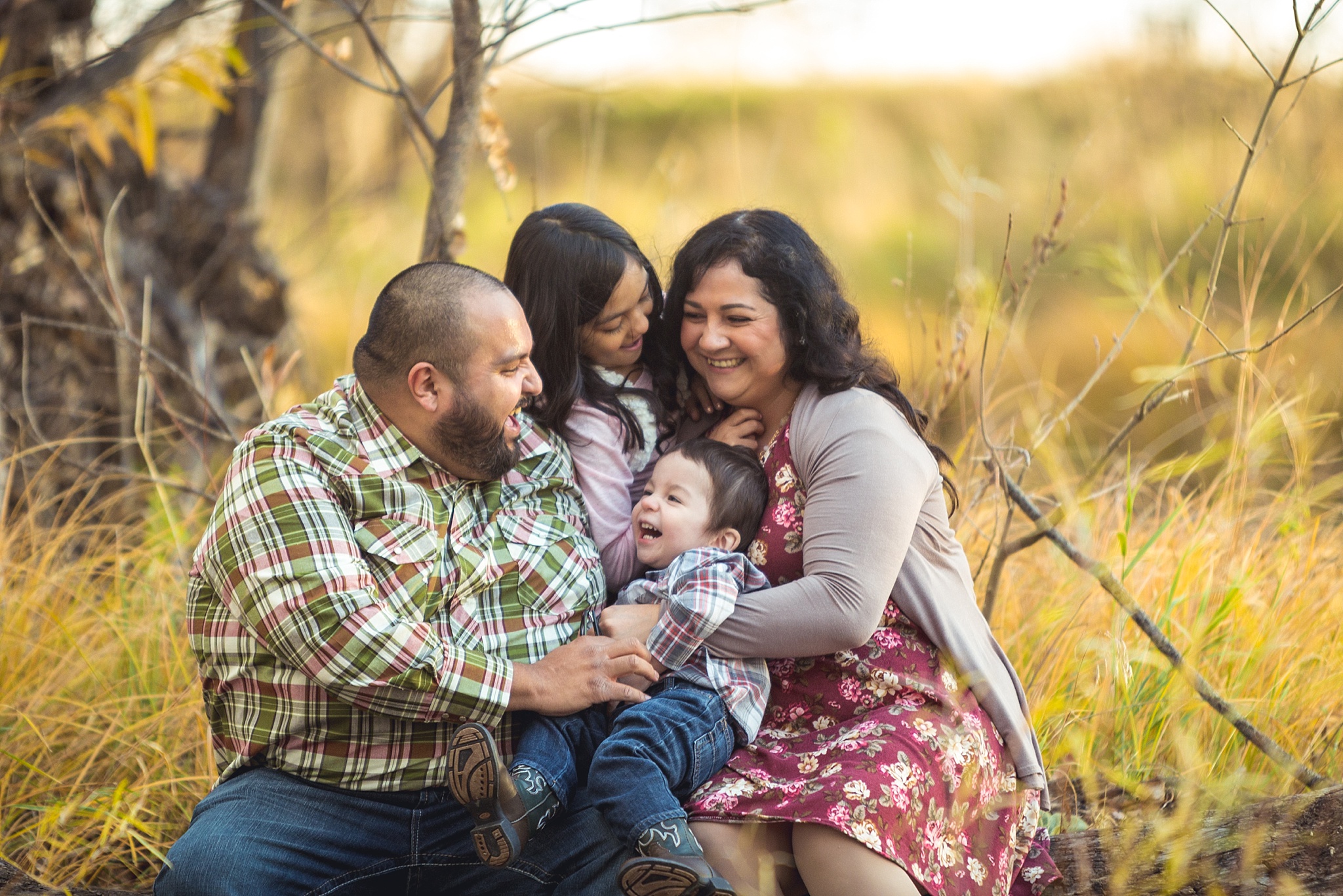 Cute family playing during fall family portraits. The Aguayo Family’s Fall Family Photo Session at Golden Ponds Nature Area by Colorado Family Photographer, Jennifer Garza. Golden Ponds Nature Area Family Photographer, Golden Ponds Nature Area, Golden Ponds, Golden Ponds Family Photographer, Longmont Family Photography, Longmont Family Photographer, Colorado Family Photos, Colorado Family Photographer, Colorado Fall Photos, Fall Photos