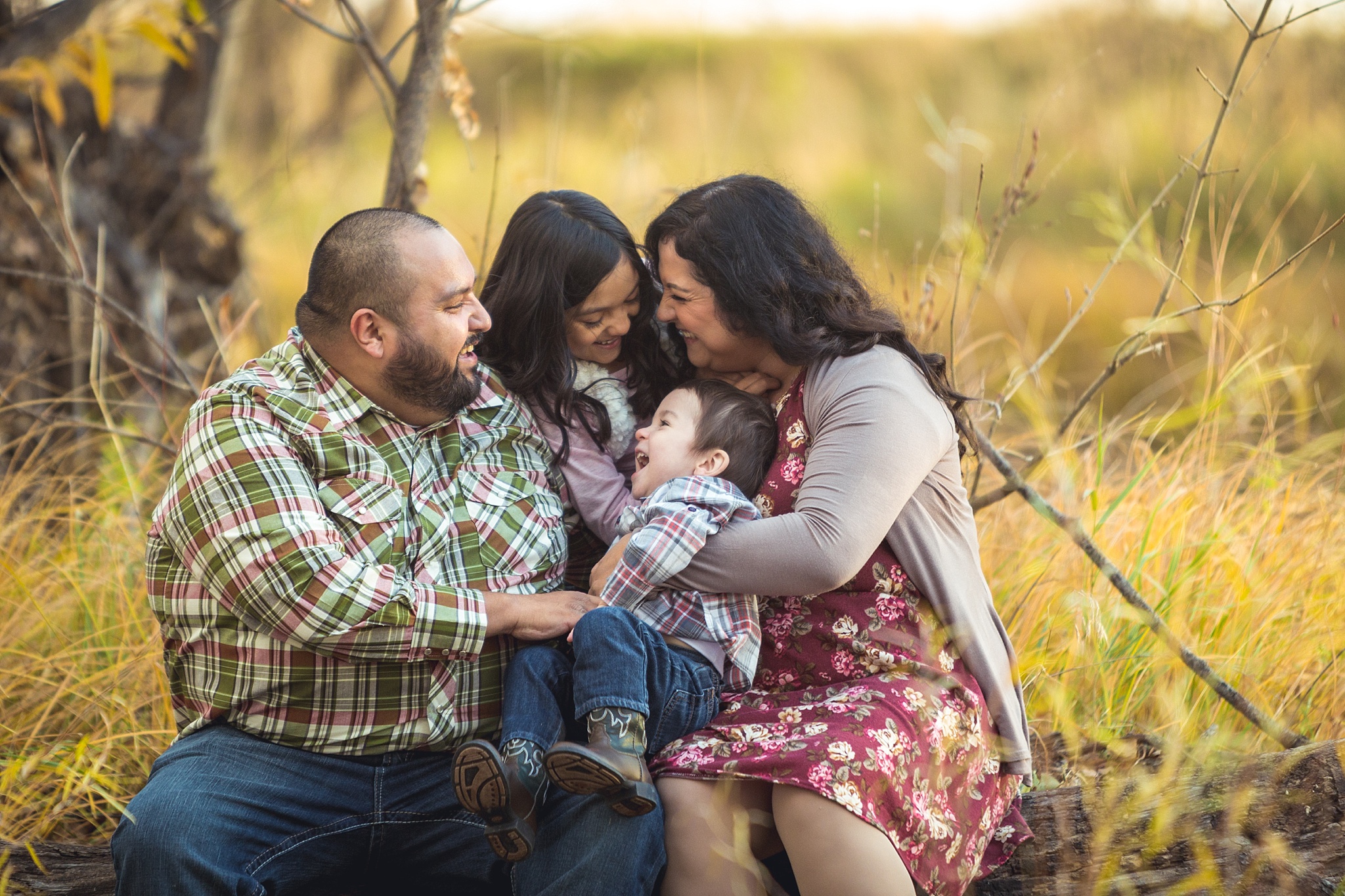 Cute family playing during fall family portraits. The Aguayo Family’s Fall Family Photo Session at Golden Ponds Nature Area by Colorado Family Photographer, Jennifer Garza. Golden Ponds Nature Area Family Photographer, Golden Ponds Nature Area, Golden Ponds, Golden Ponds Family Photographer, Longmont Family Photography, Longmont Family Photographer, Colorado Family Photos, Colorado Family Photographer, Colorado Fall Photos, Fall Photos