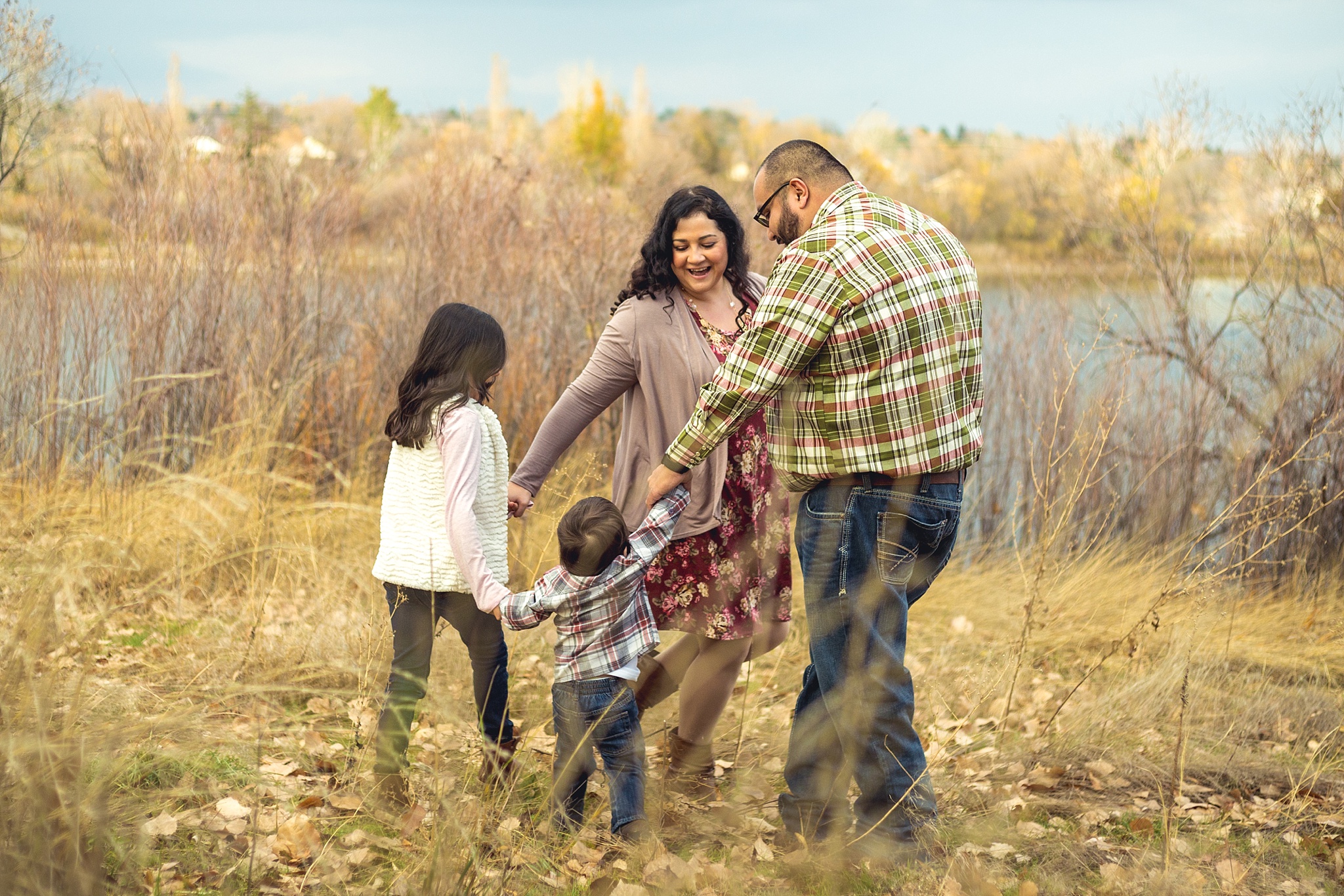 Family playing during fall family portraits. The Aguayo Family’s Fall Family Photo Session at Golden Ponds Nature Area by Colorado Family Photographer, Jennifer Garza. Golden Ponds Nature Area Family Photographer, Golden Ponds Nature Area, Golden Ponds, Golden Ponds Family Photographer, Longmont Family Photography, Longmont Family Photographer, Colorado Family Photos, Colorado Family Photographer, Colorado Fall Photos, Fall Photos