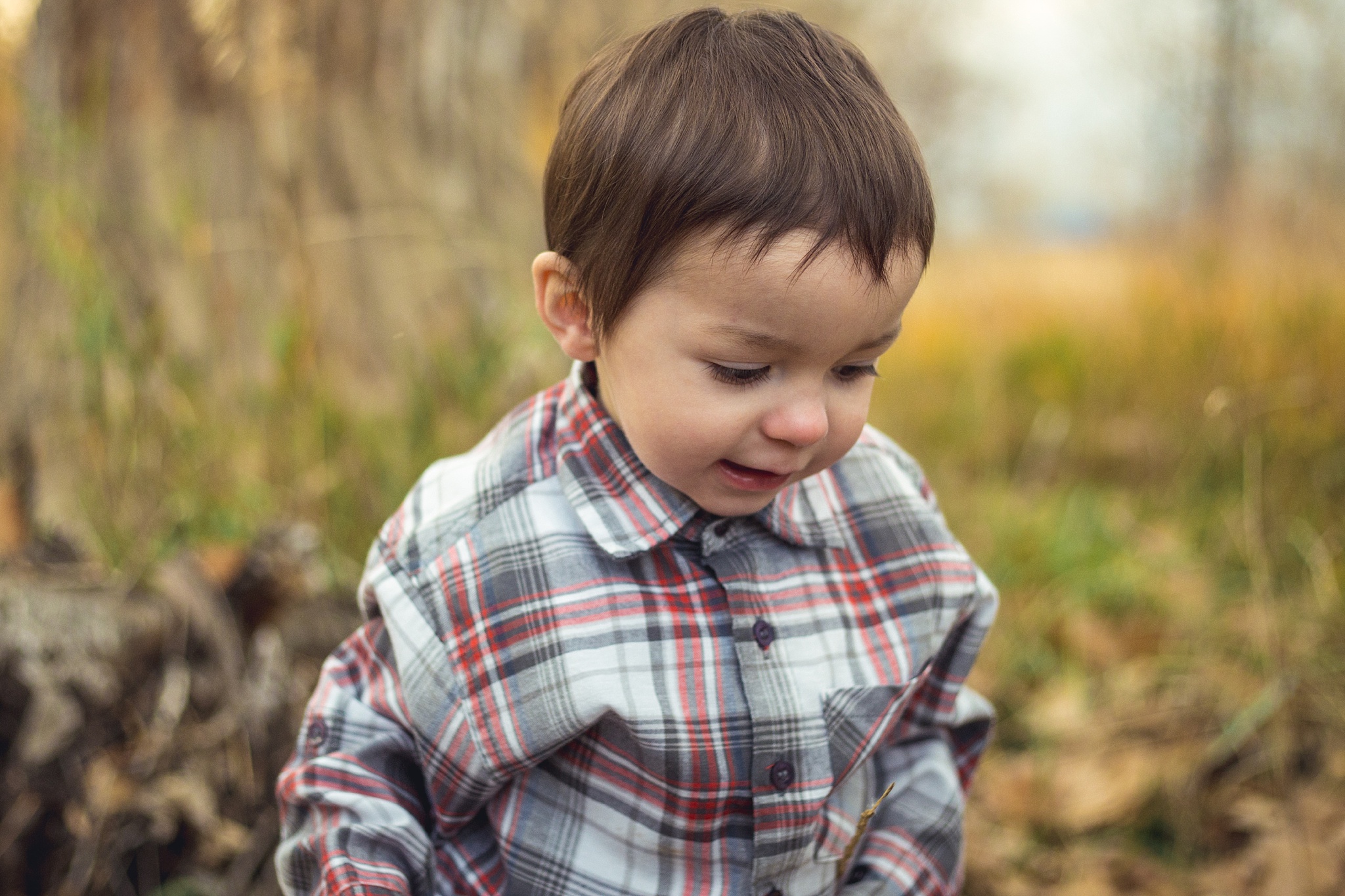 Cute little boy playing during fall family portraits. The Aguayo Family’s Fall Family Photo Session at Golden Ponds Nature Area by Colorado Family Photographer, Jennifer Garza. Golden Ponds Nature Area Family Photographer, Golden Ponds Nature Area, Golden Ponds, Golden Ponds Family Photographer, Longmont Family Photography, Longmont Family Photographer, Colorado Family Photos, Colorado Family Photographer, Colorado Fall Photos, Fall Photos