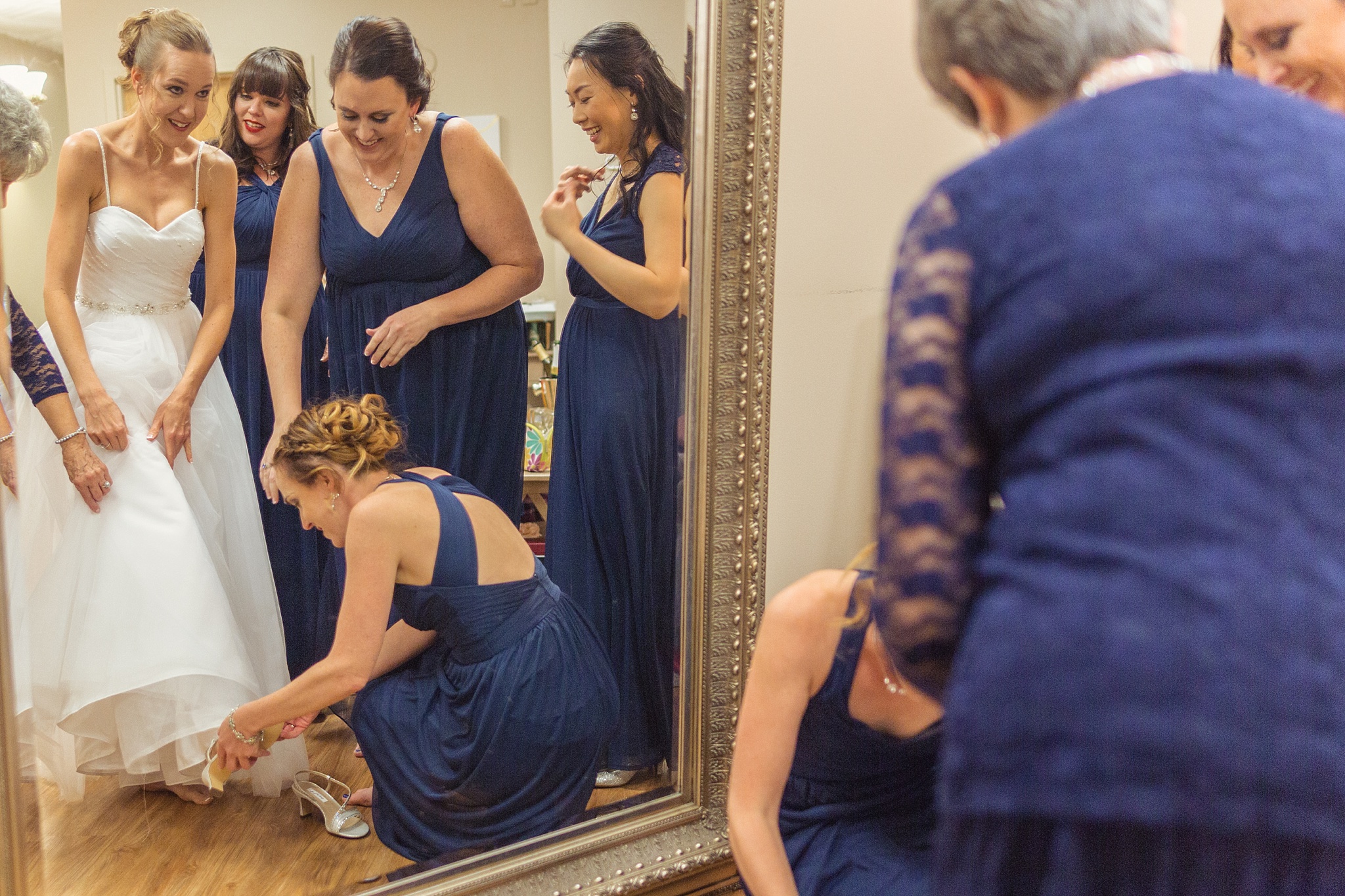 Bride getting her dress on with her bridesmaids. Sheri & Damon's Colorado Springs Wedgewood Black Forest Wedding by Colorado Wedding Photographer, Jennifer Garza. Colorado Wedding Photographer, Colorado Wedding Photography, Colorado Springs Wedding Photographer, Colorado Springs Wedding Photography, Wedgewood Weddings, Wedgewood Weddings Black Forest, Wedgewood Black Forest, Colorado Wedding, Mountain Wedding, Rocky Mountain Bride, Colorado Bride