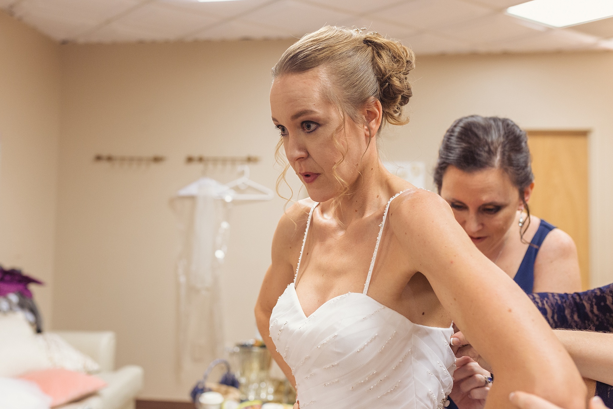 Bride getting her dress on with her bridesmaids. Sheri & Damon's Colorado Springs Wedgewood Black Forest Wedding by Colorado Wedding Photographer, Jennifer Garza. Colorado Wedding Photographer, Colorado Wedding Photography, Colorado Springs Wedding Photographer, Colorado Springs Wedding Photography, Wedgewood Weddings, Wedgewood Weddings Black Forest, Wedgewood Black Forest, Colorado Wedding, Mountain Wedding, Rocky Mountain Bride, Colorado Bride