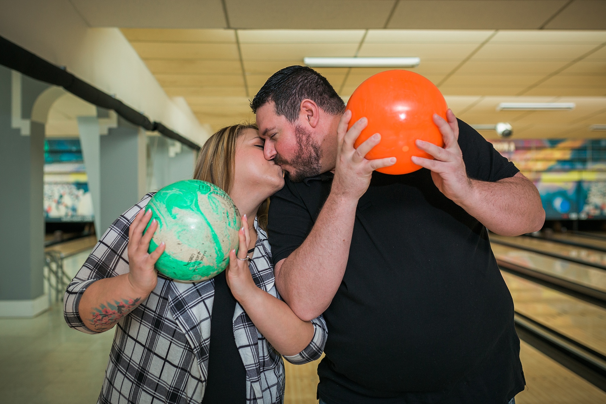 Couple holding bowling balls and kissing during their bowling alley engagement session. Briana & Kevin’s Devil’s Backbone and Sweetheart Lanes Engagement Session by Colorado Engagement Photographer, Jennifer Garza. Devil's Backbone Engagement, Devil's Backbone Engagement Session, Loveland Engagement Session, Colorado Engagement Photography, Colorado Engagement Photos, Sweetheart Lanes Bowling Alley, Bowling Alley Engagement, Bowling Engagement Session, Bowling Engagement Photography, Wedding Inspo, Colorado Wedding, Colorado Bride, Brides of Colorado, Bride to Be, Couples Goals