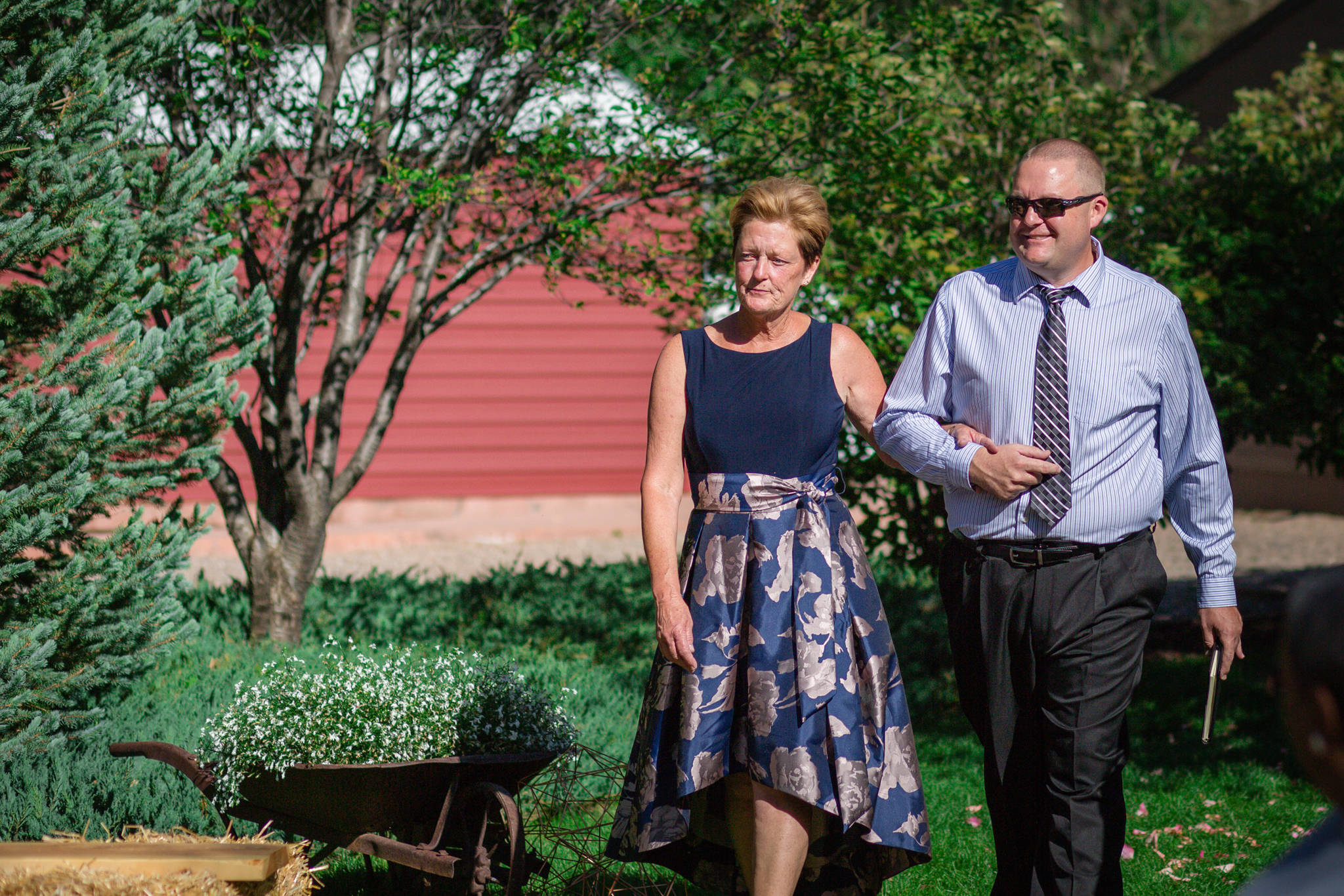 Bride’s mother and brother walking down the aisle at the beginning ceremony. Kyley & Brian's Boulder Backyard Wedding and The Mediterranean Restaurant Reception by Colorado Wedding Photographer, Jennifer Garza. Colorado Wedding Photographer, Colorado Wedding Photography, Colorado Top Wedding Photographer, Boulder Wedding Photographer, Boulder Wedding, Backyard Wedding Photographer, Backyard Wedding, The Mediterranean Restaurant, The Med, The Med Reception, Intimate Wedding, Small Intimate Wedding, Rocky Mountain Wedding, Rocky Mountain Bride, Colorado Bride, Here Comes the Bride, Couples Goals, Brides of Colorado