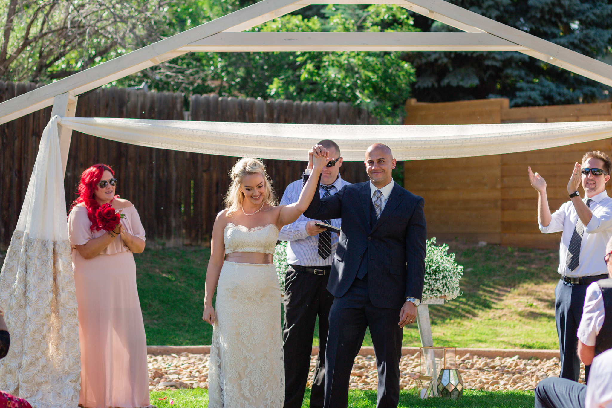 Bride and Groom’s being announced at the end of their wedding ceremony. Kyley & Brian's Boulder Backyard Wedding and The Mediterranean Restaurant Reception by Colorado Wedding Photographer, Jennifer Garza. Colorado Wedding Photographer, Colorado Wedding Photography, Colorado Top Wedding Photographer, Boulder Wedding Photographer, Boulder Wedding, Backyard Wedding Photographer, Backyard Wedding, The Mediterranean Restaurant, The Med, The Med Reception, Intimate Wedding, Small Intimate Wedding, Rocky Mountain Wedding, Rocky Mountain Bride, Colorado Bride, Here Comes the Bride, Couples Goals, Brides of Colorado