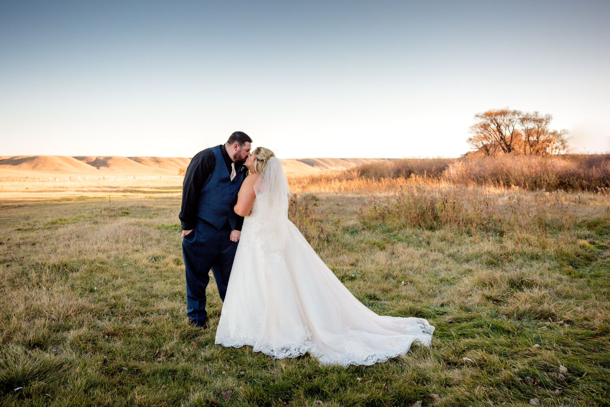 The bride and groom kissing in a field during their portrait session. Briana and Kevin's Terry Bison Ranch Wedding by Wyoming Wedding Photographer Jennifer Garza, Wyoming Wedding, Wyoming Wedding Photographer, Wyoming Engagement Photographer, Wyoming Bride, Couples Goals, Wyoming Wedding, Wedding Photographer, Wyoming Photographer, Wyoming Wedding Photography, Wedding Inspiration, Destination Wedding Photographer, Fall Wedding, Ranch Wedding, Rustic Wedding Inspiration, Wedding Dress Inspo