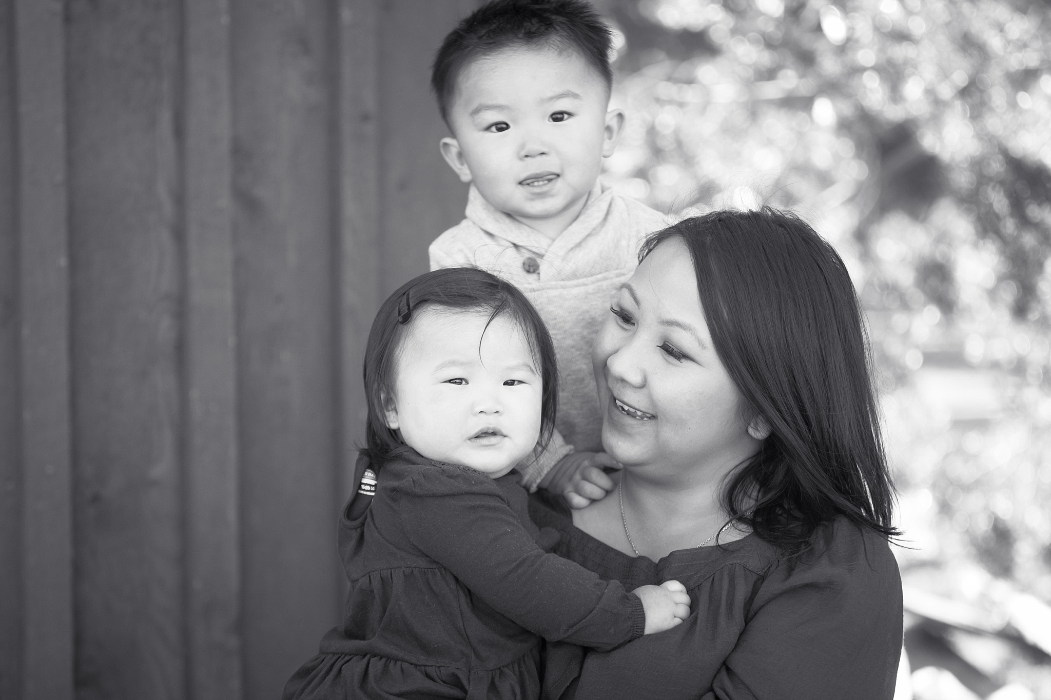 Mother holding her two children. The Lee & Lor’s Family Photo Session at Clear Creek History Park by Colorado Family Photographer, Jennifer Garza. Colorado Family Photography, Colorado Family Photographer, Clear Creek History Park Family Photographer, Clear Creek History Park Family Photography, Clear Creek History Park, Golden History Park Family Photographer, Golden Family Photographer, Golden Family Photography, Golden History Park, Denver Family Photos, Denver Family Photography