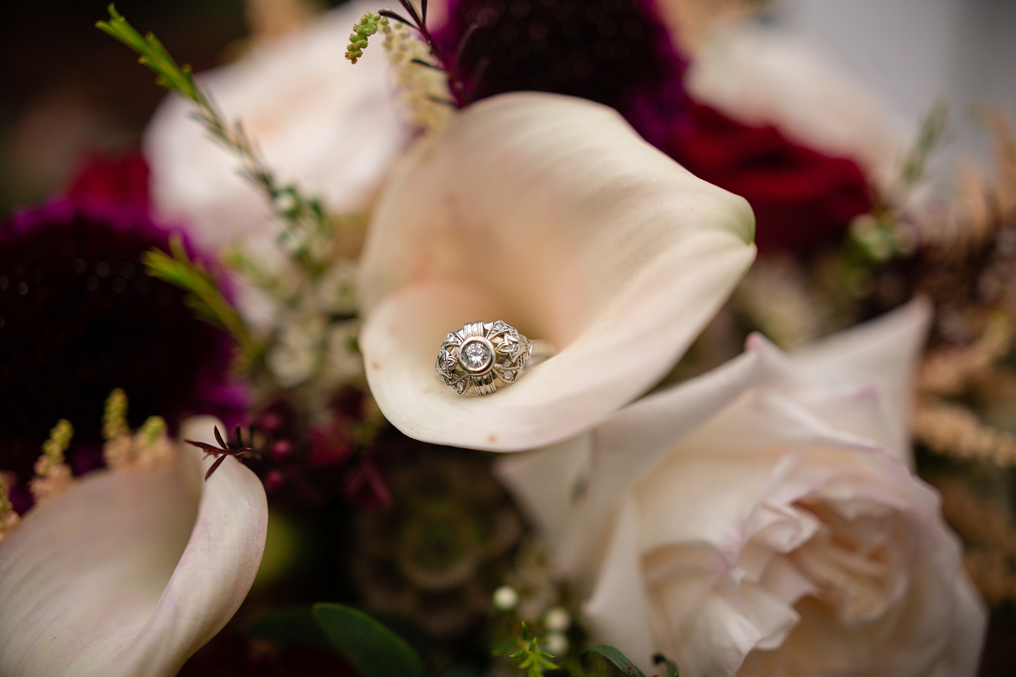 Close-up photo of wedding ring in the bridal bouquet. Tania & Chris' Denver Wedding at the Wedgewood Ken Caryl by Colorado Wedding Photography, Jennifer Garza. Colorado Wedding Photographer, Colorado Wedding Photography, Denver Wedding Photographer, Denver Wedding Photography, US Marine Corp Wedding, US Marine Corp, Military Wedding, US Marines, Wedgewood Weddings, Wedgewood Weddings Ken Caryl, Colorado Wedding, Denver Wedding, Wedding Photographer, Colorado Bride, Brides of Colorado