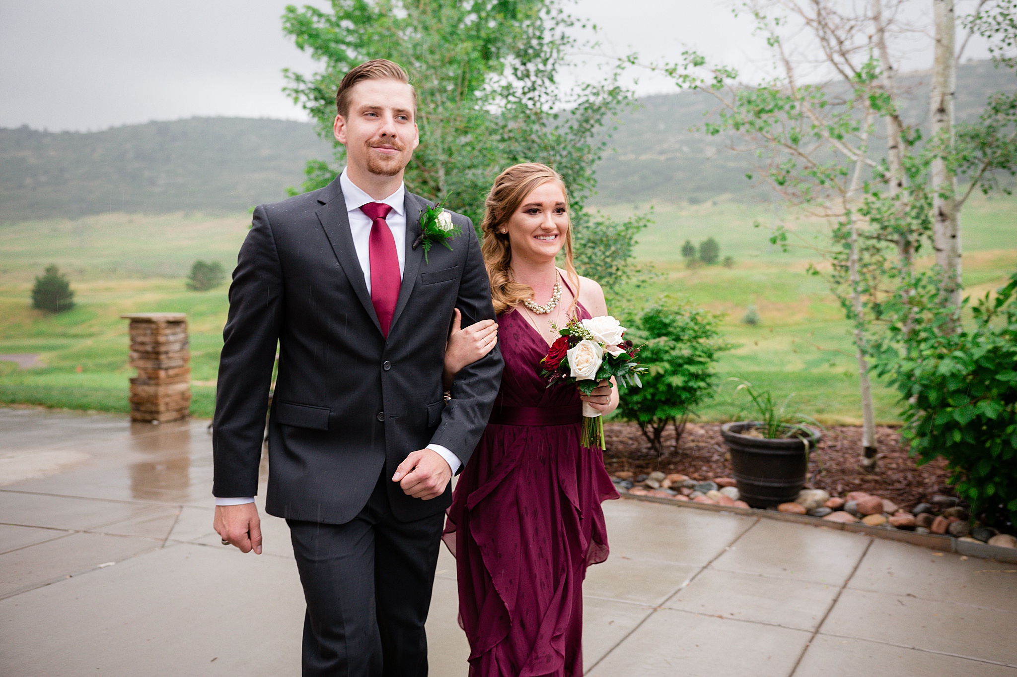 Bridal party walking down the aisle at a rainy summer wedding. Tania & Chris' Denver Wedding at the Wedgewood Ken Caryl by Colorado Wedding Photography, Jennifer Garza. Colorado Wedding Photographer, Colorado Wedding Photography, Denver Wedding Photographer, Denver Wedding Photography, US Marine Corp Wedding, US Marine Corp, Military Wedding, US Marines, Wedgewood Weddings, Wedgewood Weddings Ken Caryl, Colorado Wedding, Denver Wedding, Wedding Photographer, Colorado Bride, Brides of Colorado